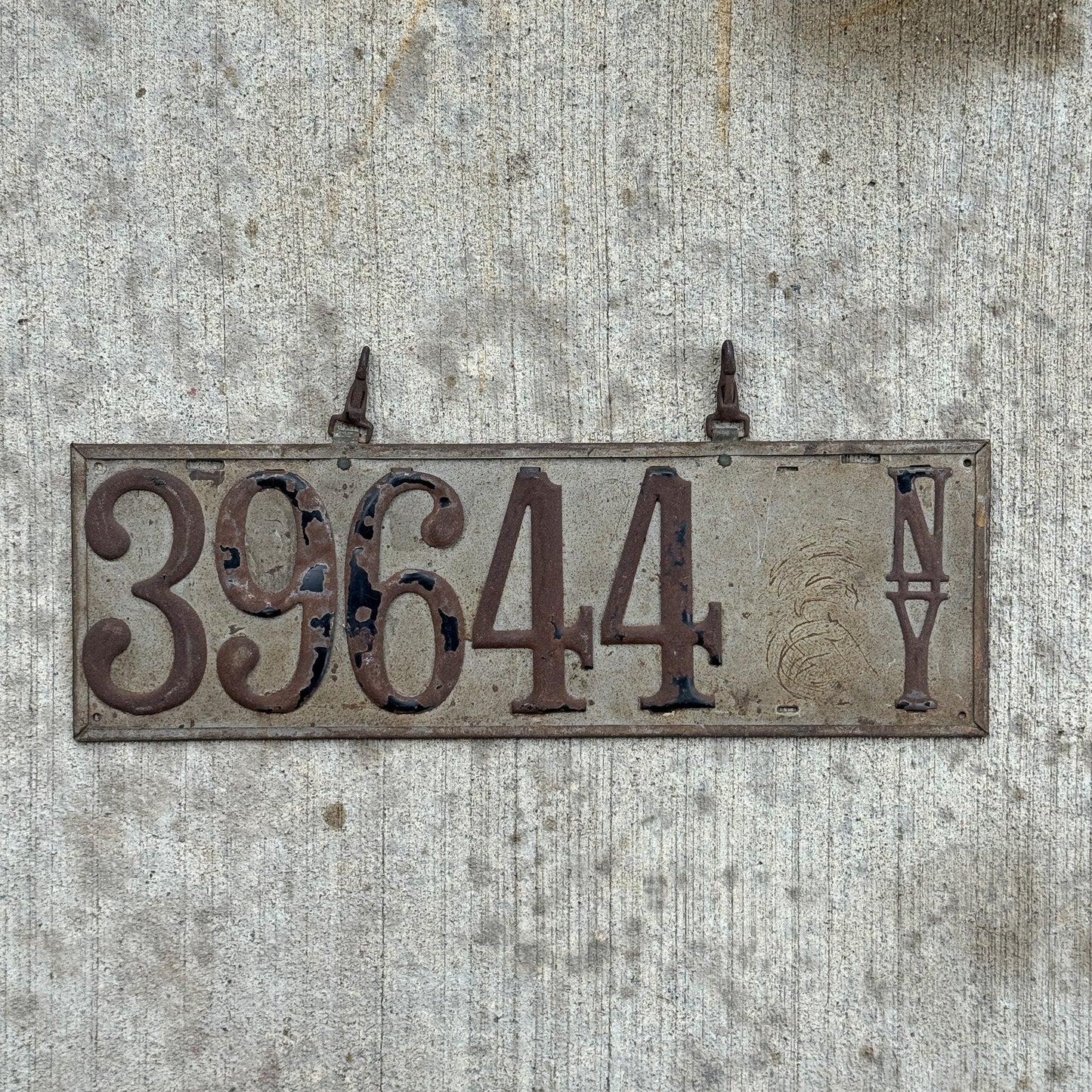 Photo of a 1907 New York Prestate License Plate Auto Tag Garage Decor Vintage Early 39644 with original patina