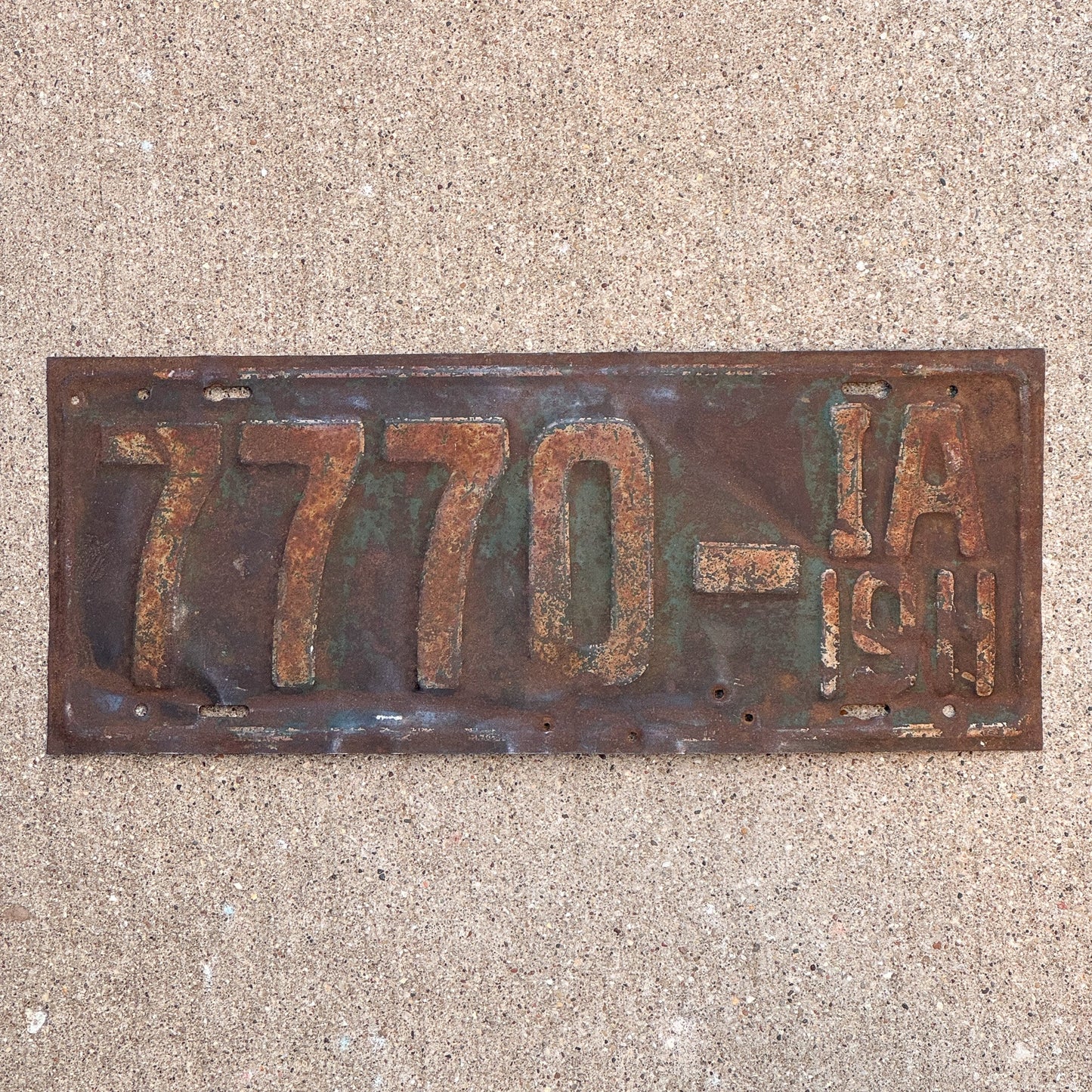 Photo of a 1911 Iowa License Plate Auto Tag Garage Decor Vintage First Issue Lucky 7 Repeat Repeating 7770 with original patina
