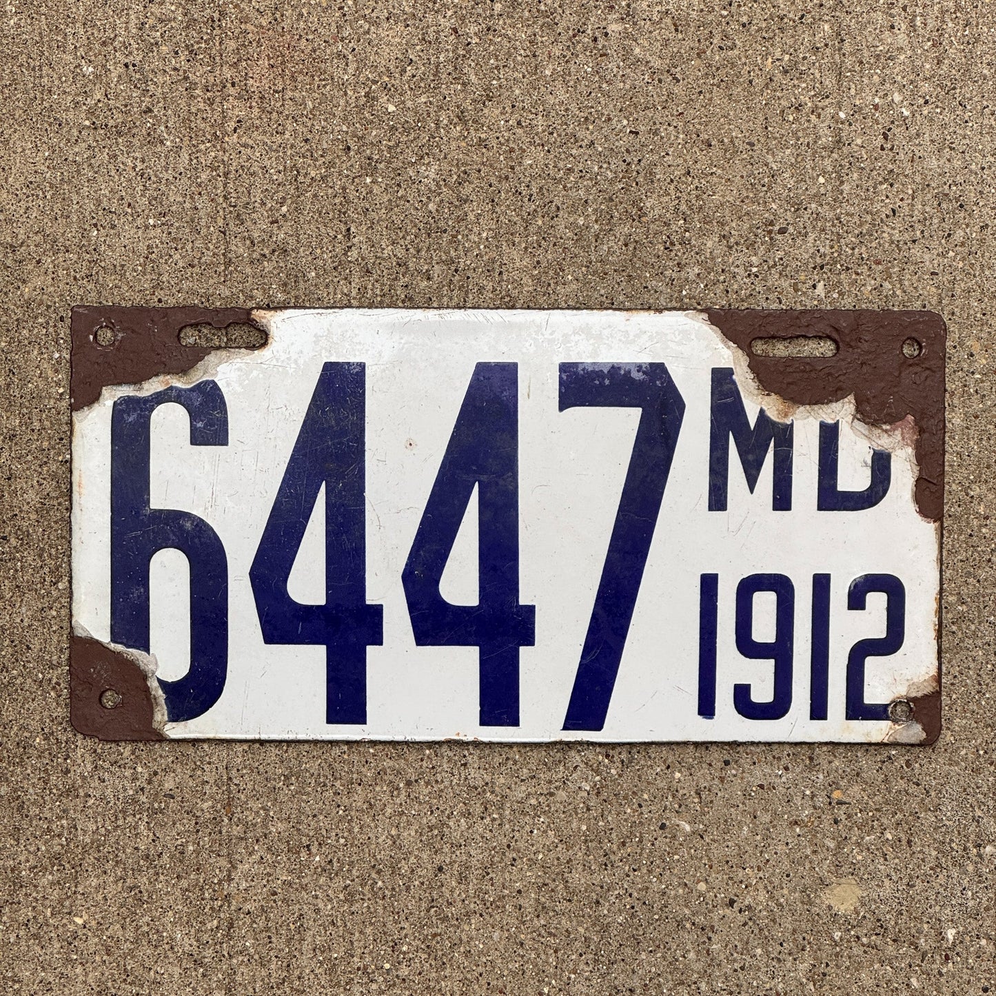 Photo of a 1912 Maryland Porcelain License Plate Auto Tag Garage Decor Vintage Low Number Four Digit 6447 with original patina