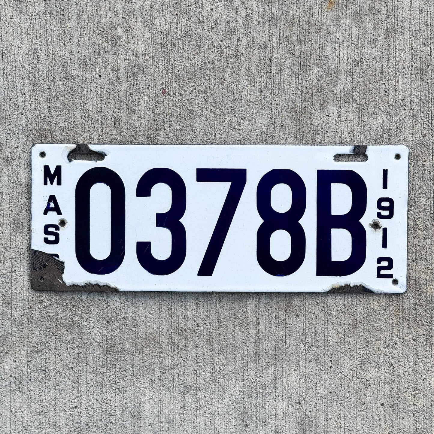 Photo of a 1912 Massachusetts Porcelain Dealer License Plate Auto Tag Garage Decor Vintage 0378 B with original patina