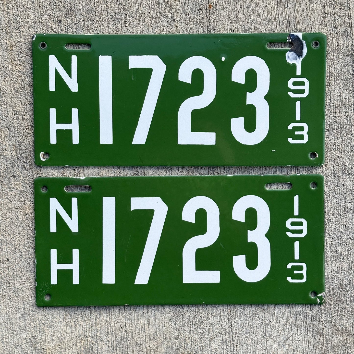 Photo of a 1913 New Hampshire Porcelain License Plate Pair Auto Tag Garage Decor Vintage Low Number Four Digit High Quality 1723 with original patina