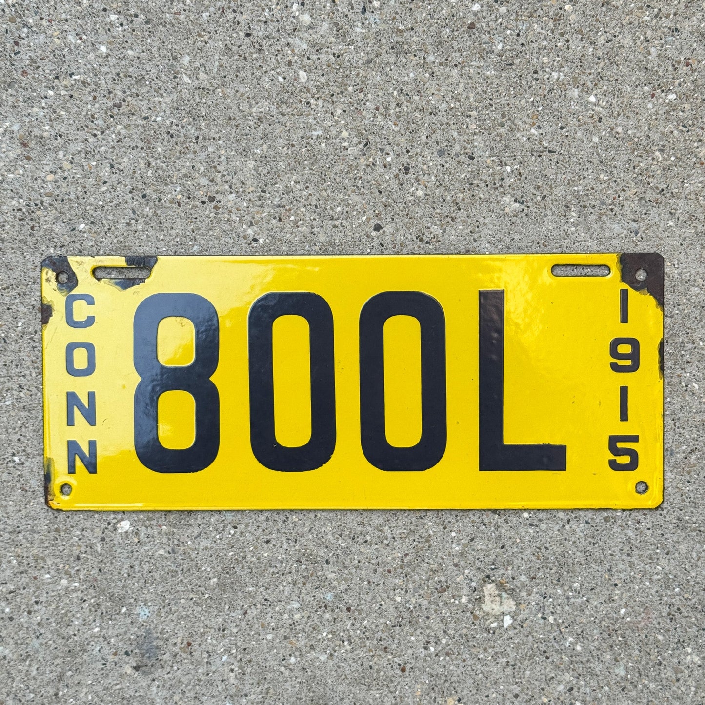 Photo of a 1915 Connecticut Livery Porcelain License Plate Auto Tag Garage Decor Vintage Low Number Three Digit 800 L with original patina