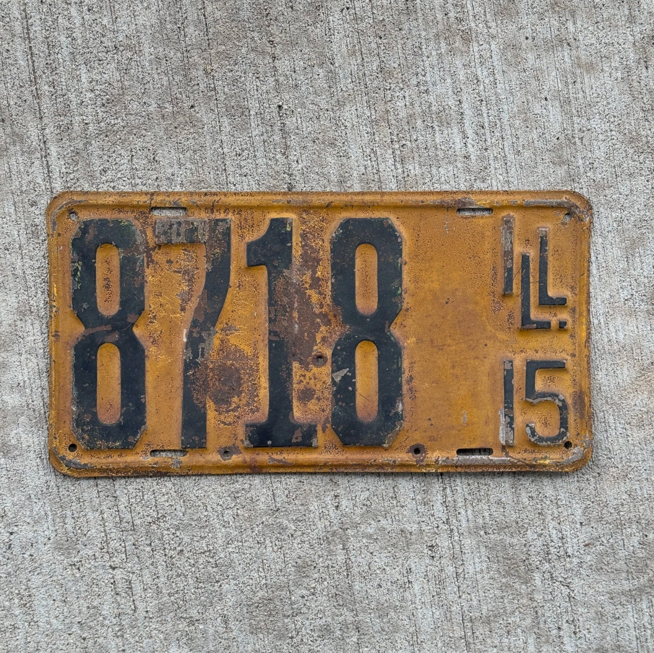 Photo of a 1915 Illinois License Plate Auto Tag Garage Decor Vintage Low Number Four Digit 8718 with original patina