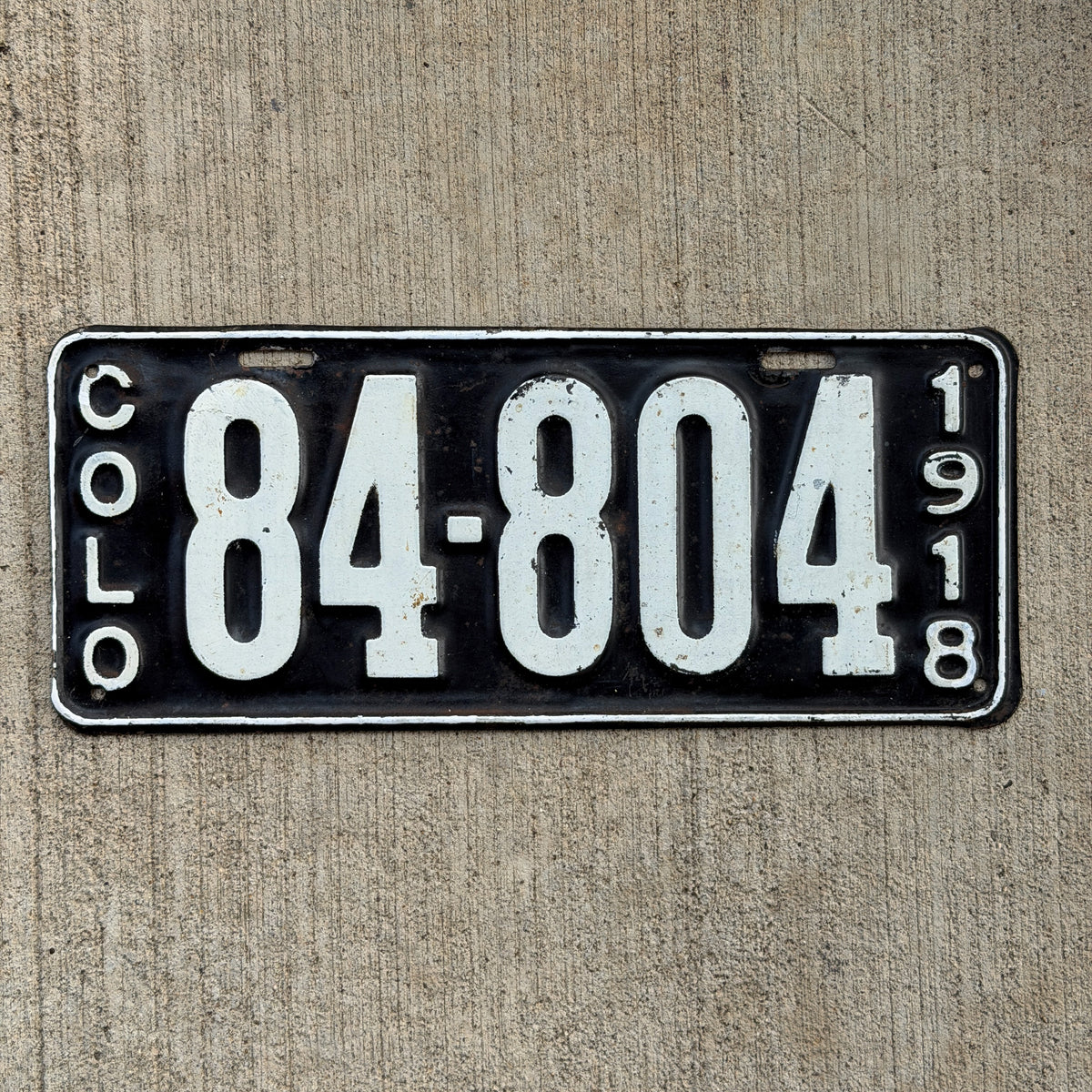 Photo of a 1918 Colorado License Plate Auto Tag Garage Decor Vintage Tab Letter A High Horse Power 84 804 with original patina
