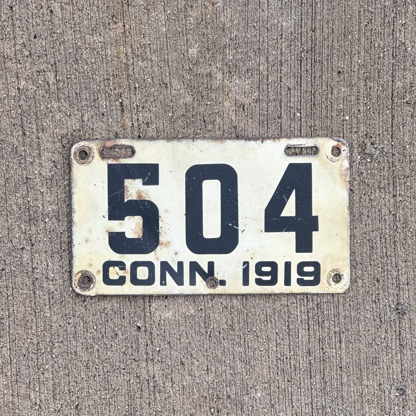 Photo of a 1919 Connecticut Motorcycle License Plate Auto Tag Garage Decor Vintage ALPCA Archive Example Low Number Three Digit 504 with original patina
