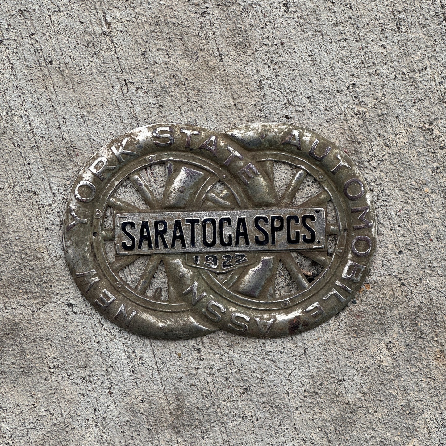 Photo of a 1922 Saratoga Springs New York Badge Emblem License Plate Topper Auto Tag Garage Decor Vintage Motor Club with original patina