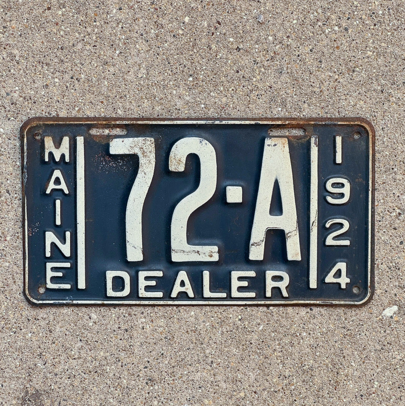Photo of a 1924 Maine Dealer License Plate Auto Tag Garage Decor Vintage Low Number Two Digit 72 A with original patina