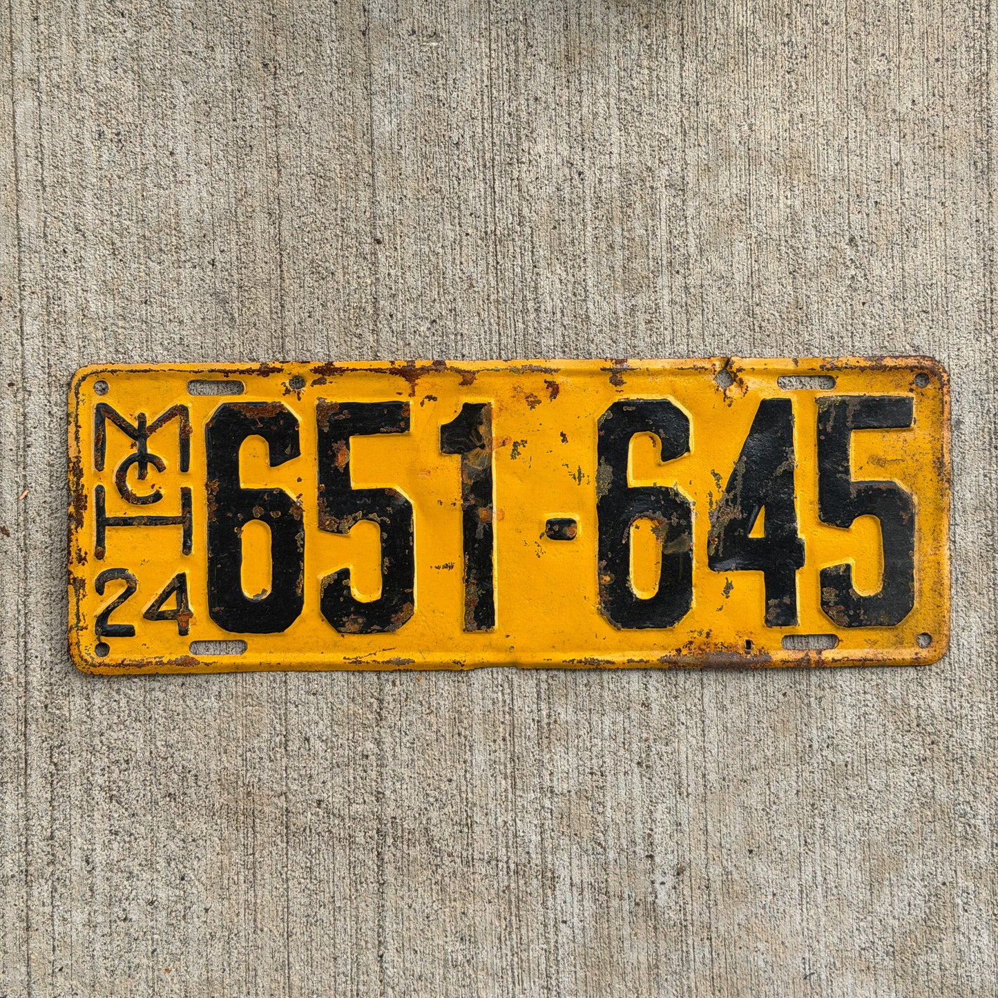 Photo of a 1924 Michigan License Plate Auto Tag Garage Decor Vintage 651 645 with original patina