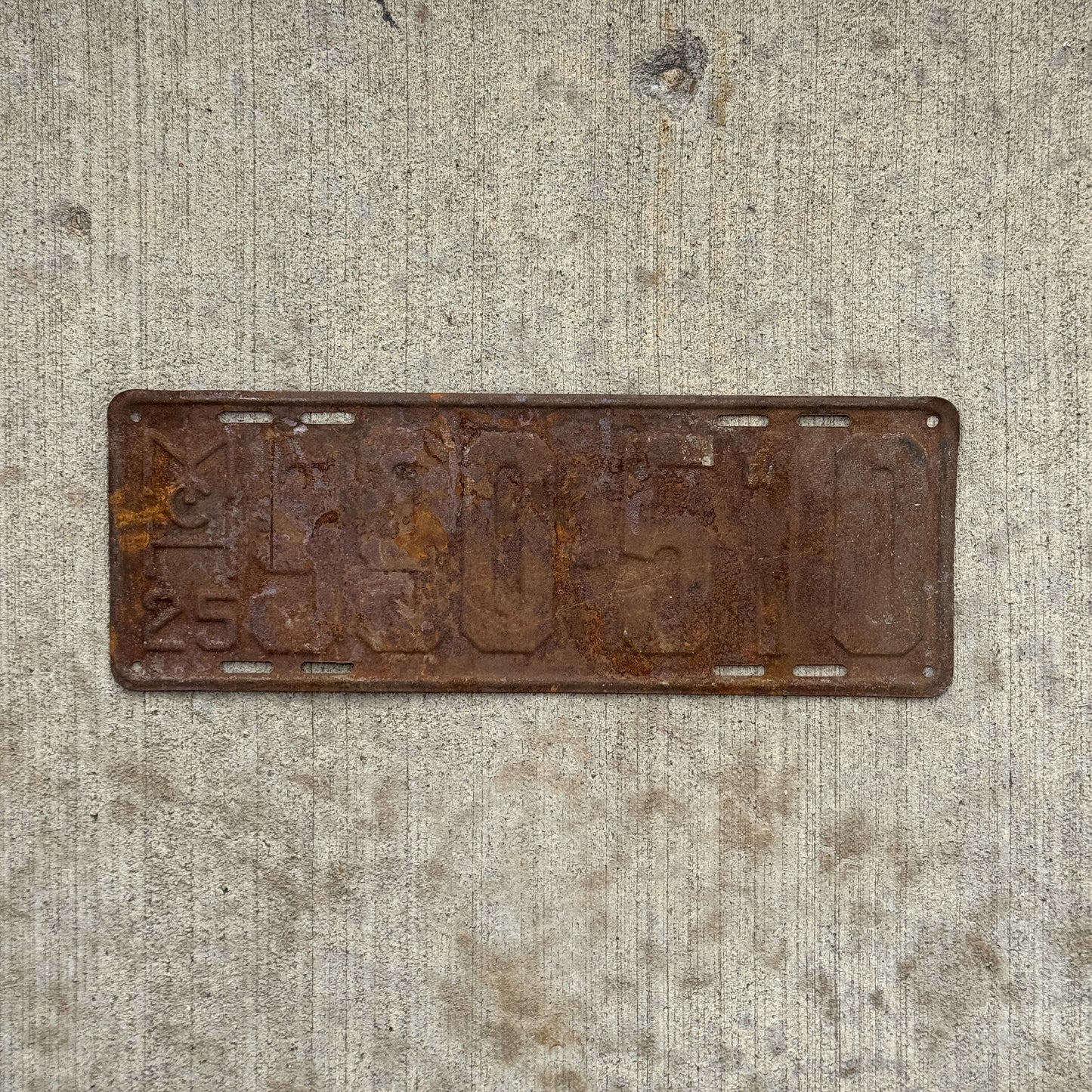 Photo of a 1925 Michigan License Plate Auto Tag Garage Decor Vintage 990 510 with original patina