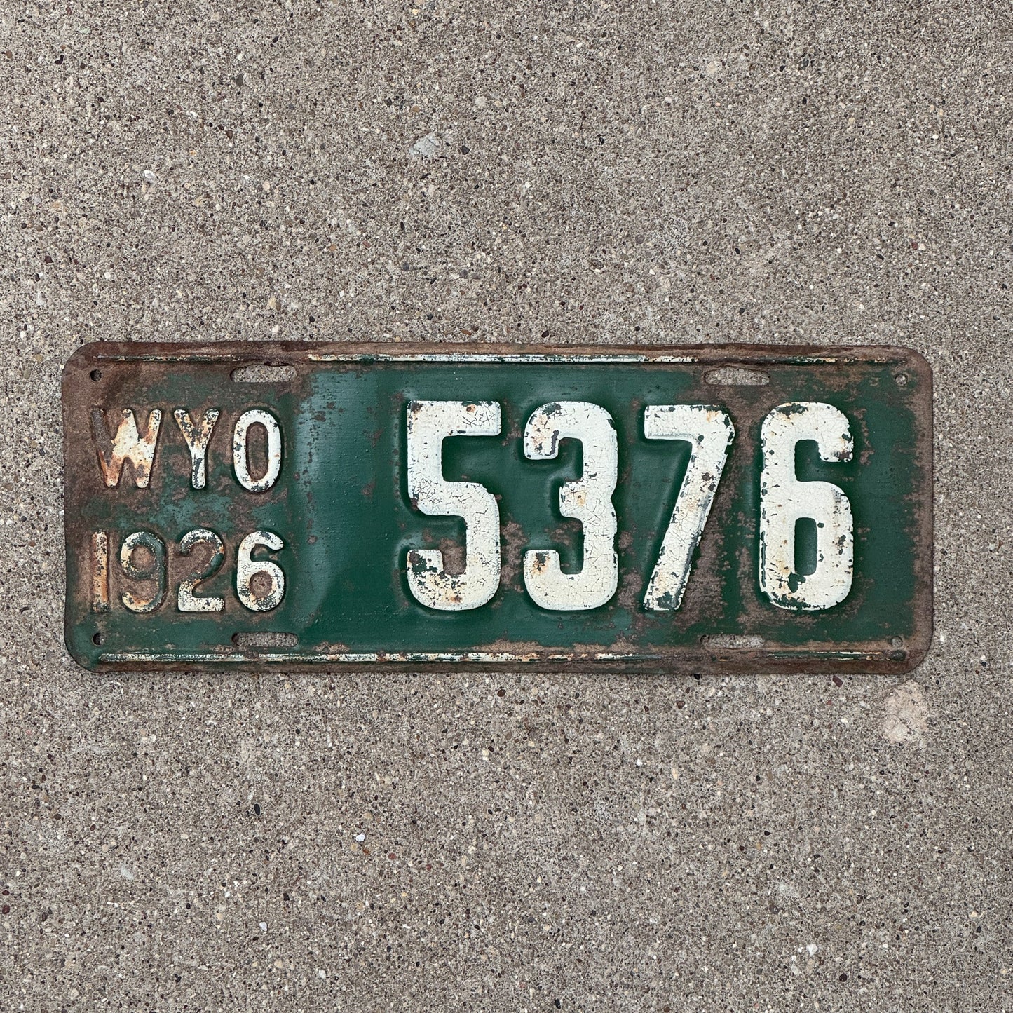 Photo of a 1926 Wyoming License Plate Auto Tag Garage Decor Vintage Low Number Four Digit 5376 with original patina