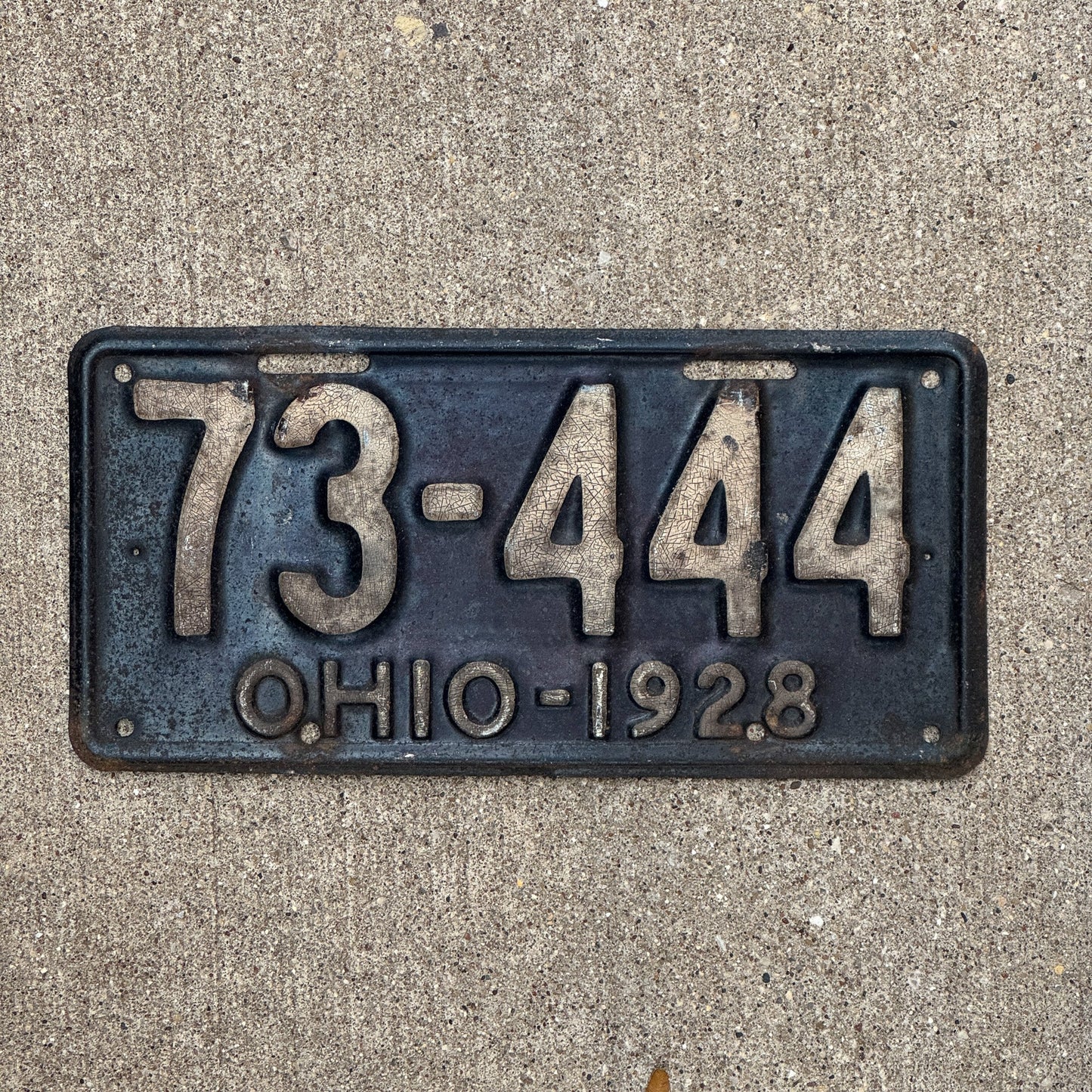 Photo of a 1928 Ohio License Plate Auto Tag Garage Decor Vintage Repeat Repeating 73 444 with original patina