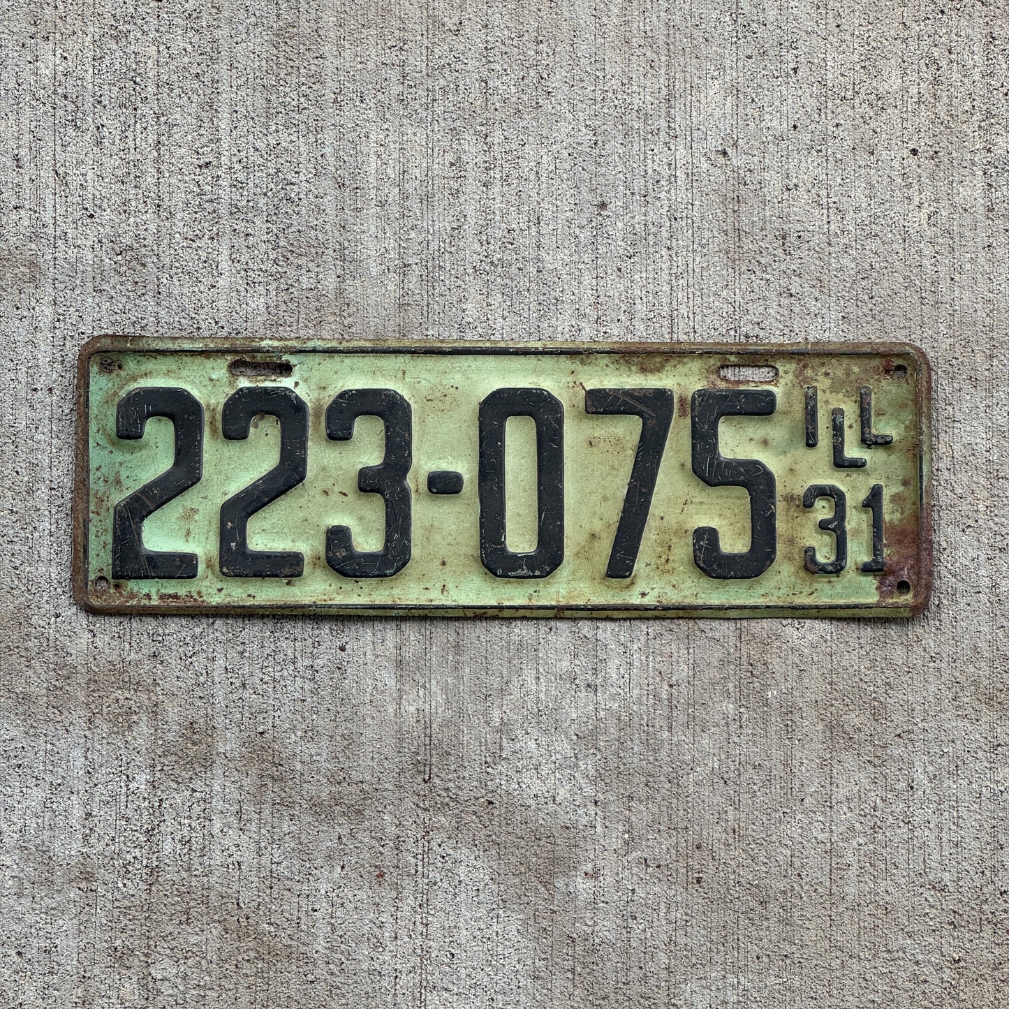 Photo of a 1931 Illinois License Plate Auto Tag Garage Decor Vintage Ford Model A Year 223 075 with original patina