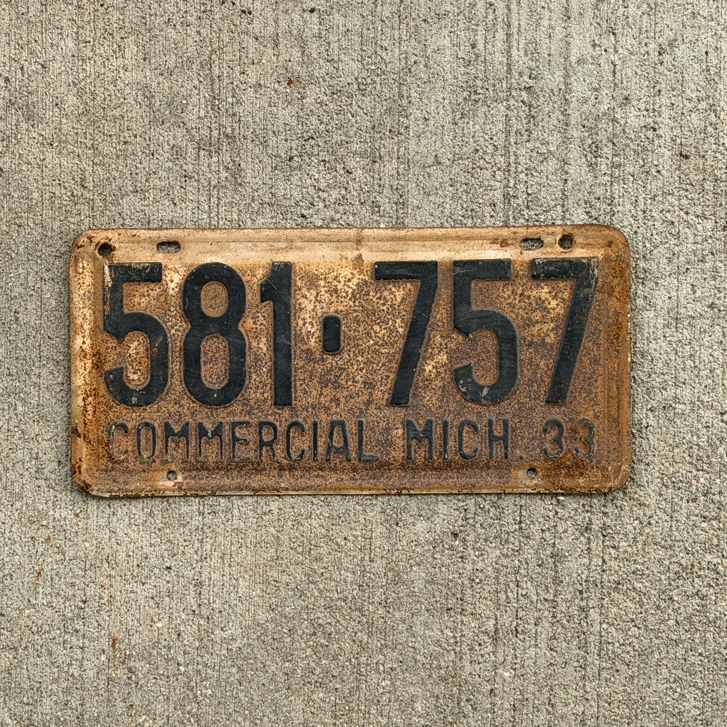 Photo of a 1933 Michigan Commercial License Plate Auto Tag Garage Decor Vintage 581 757 with original patina