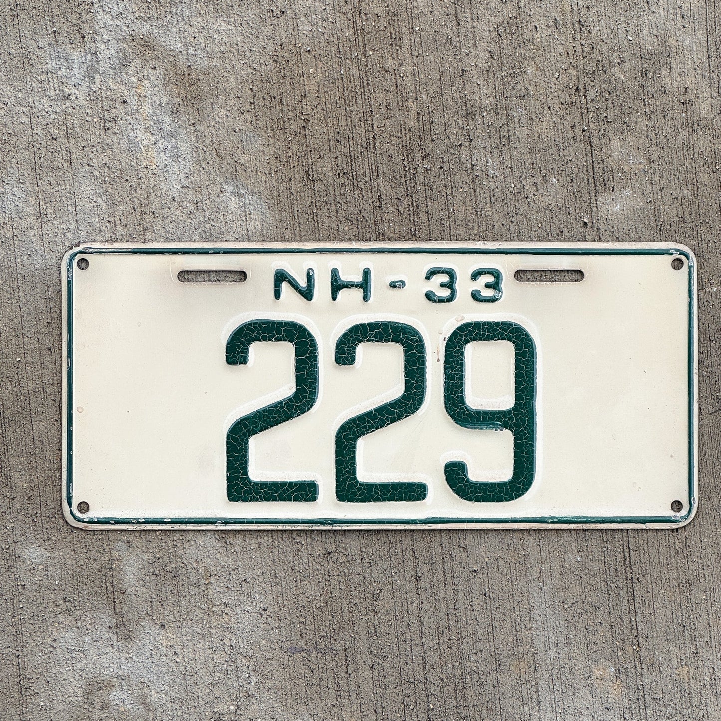 Photo of a 1933 New Hampshire License Plate Auto Tag Garage Decor Vintage Low Number Three Digit 229 with original patina