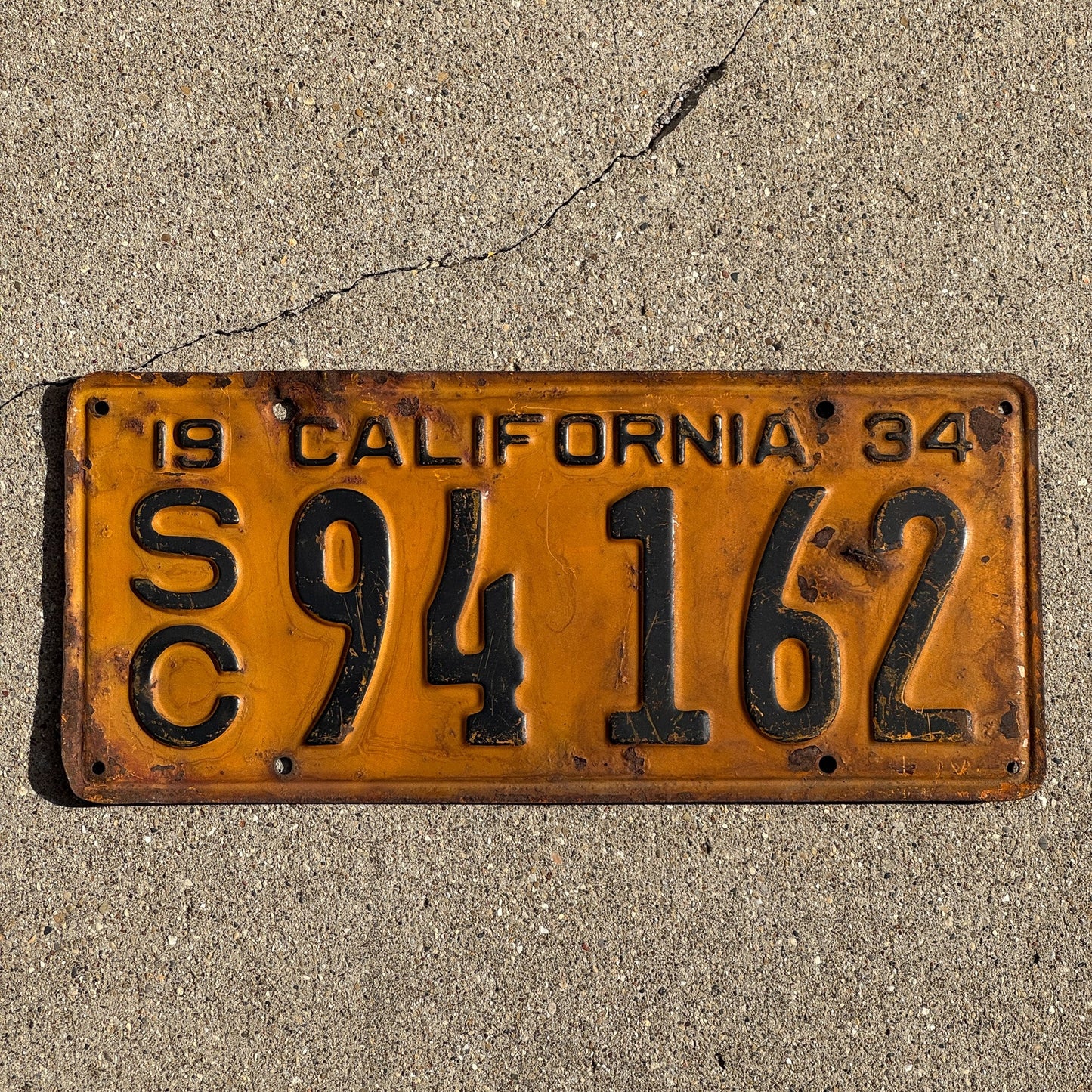 Photo of a 1934 California Commercial License Plate Auto Tag Garage Decor Vintage SC 94 162