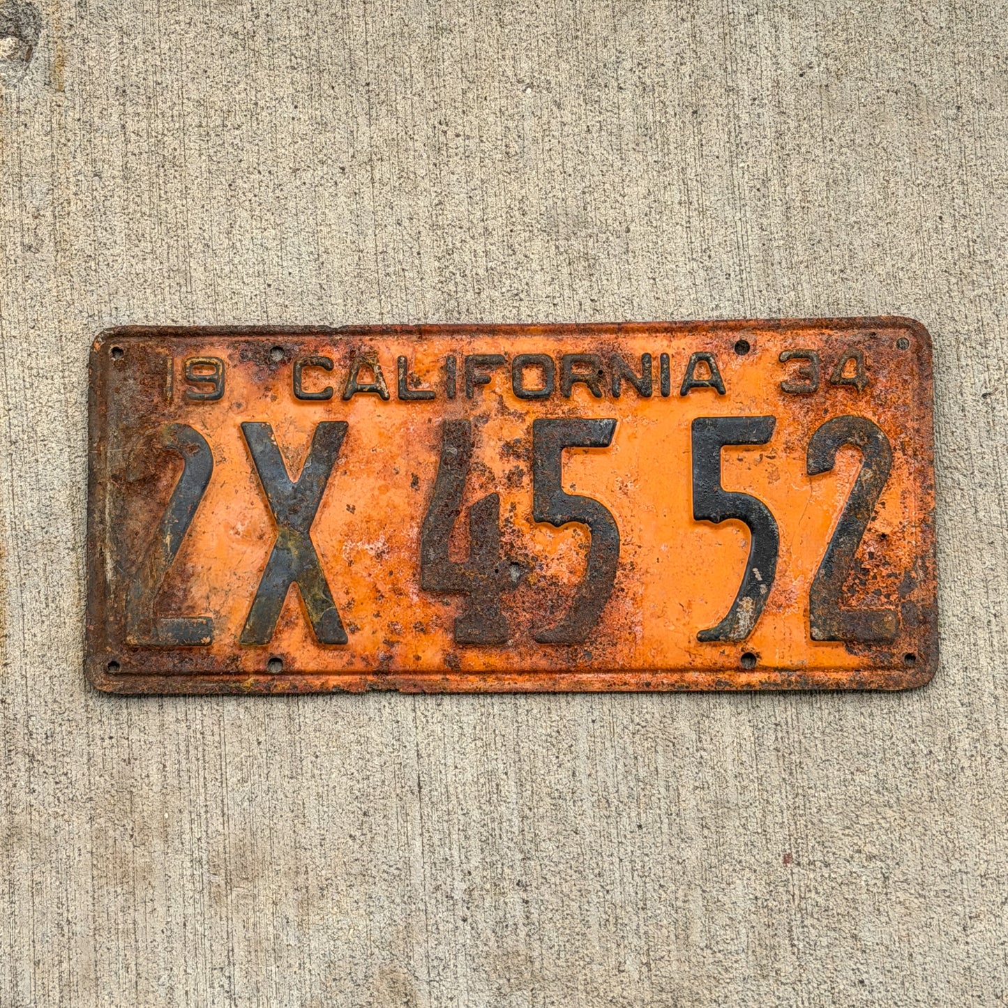 Photo of a 1934 California License Plate Auto Tag Garage Decor Vintage 2X 45 52 with original patina