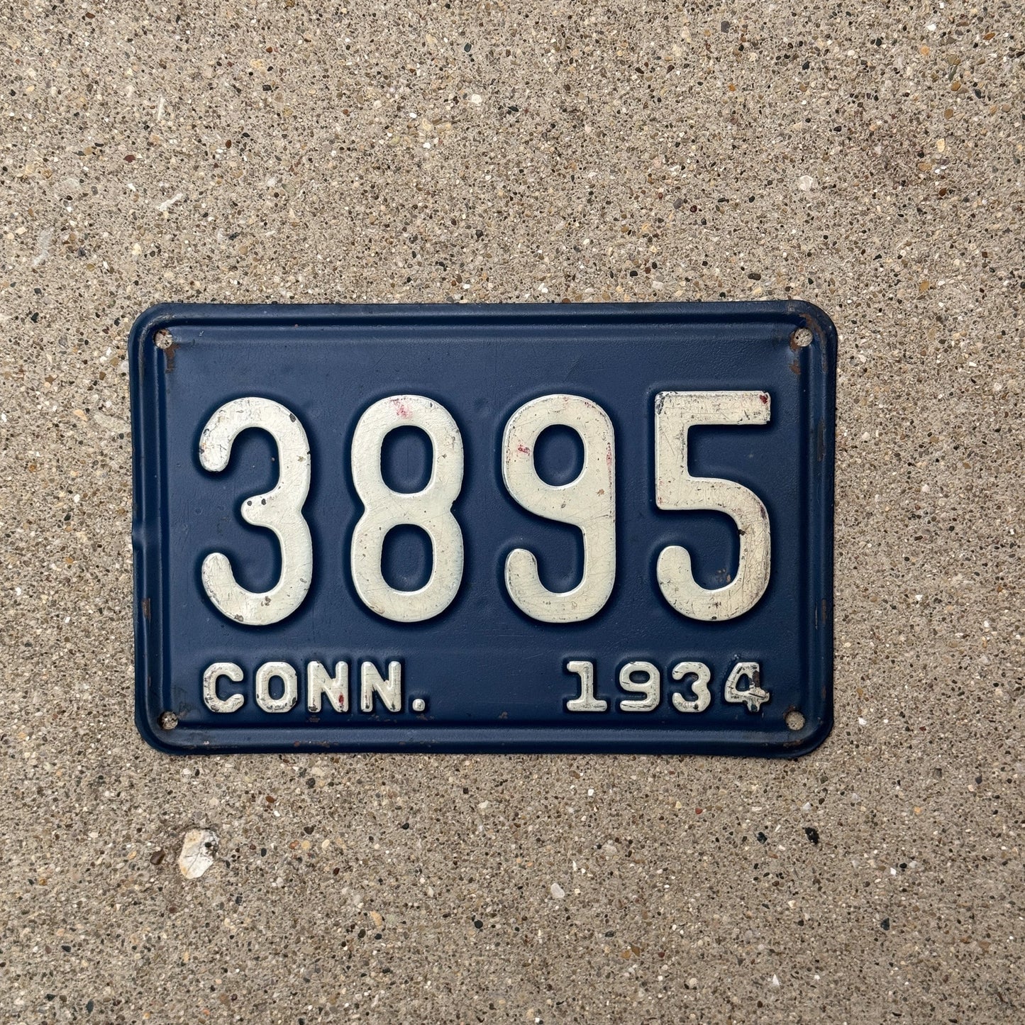 Photo of a 1934 Connecticut License Plate Auto Tag Garage Decor Vintage Low Number Four Digit 3895 with original patina