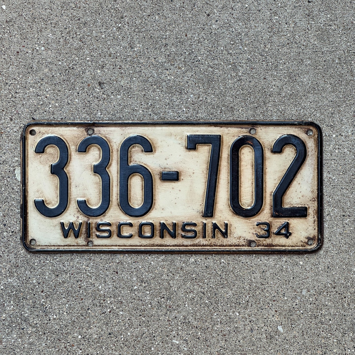 Photo of a 1934 Wisconsin License Plate Auto Tag Garage Decor Vintage 336 702