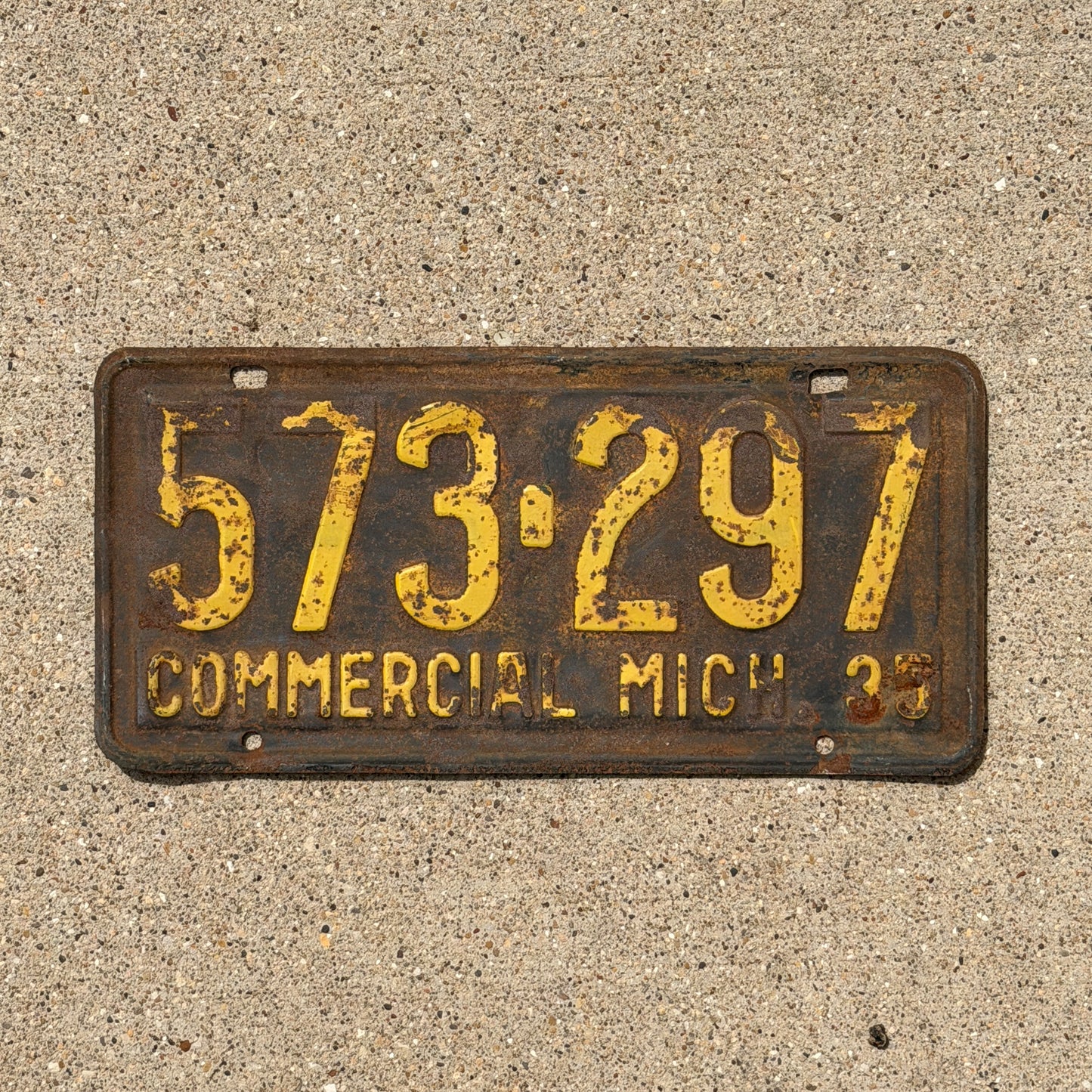 Photo of a 1935 Michigan Commercial License Plate Auto Tag Garage Decor Vintage 573 297 with original patina