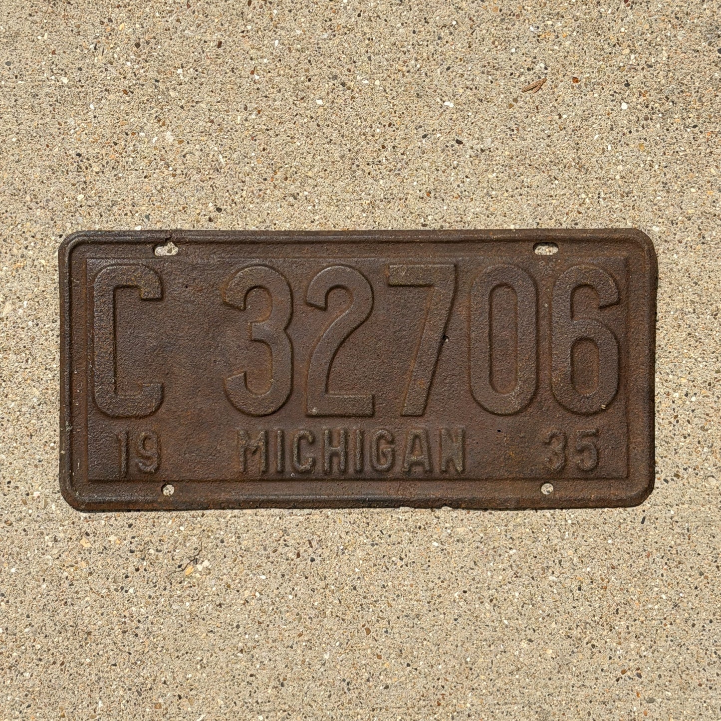 Photo of a 1935 Michigan License Plate Auto Tag Garage Decor Vintage C 32706 with original patina