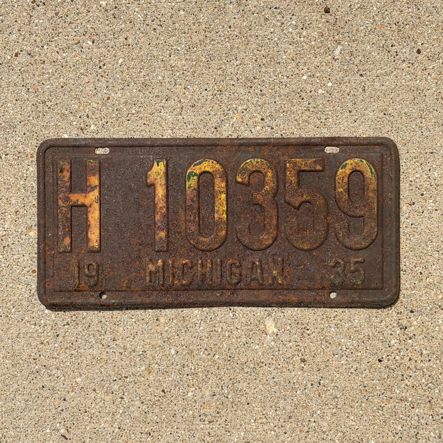 Photo of a 1935 Michigan License Plate Auto Tag Garage Decor Vintage H 10359 with original patina