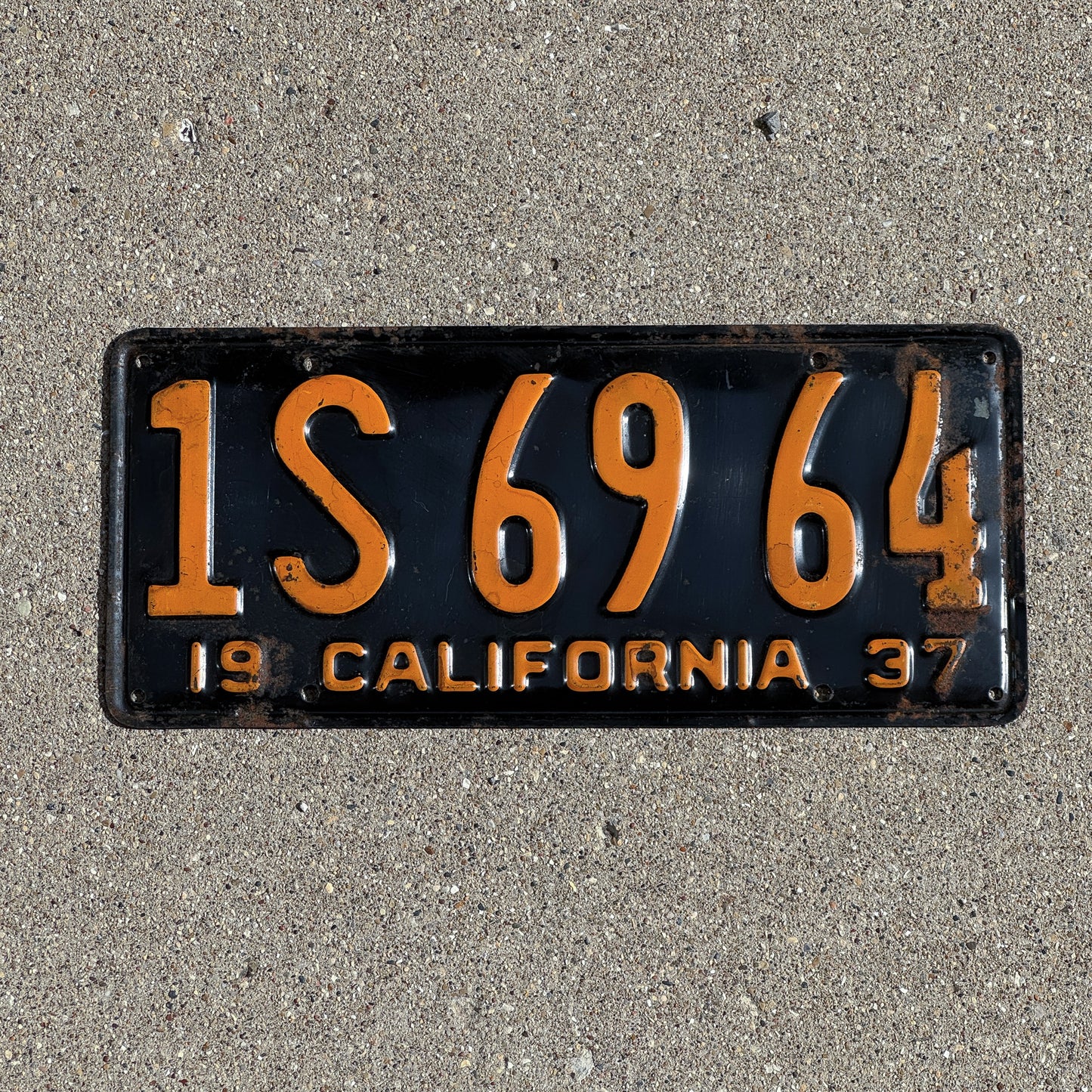 Photo of a 1937 California License Plate Auto Tag Garage Decor Vintage 1S 69 64 with original patina