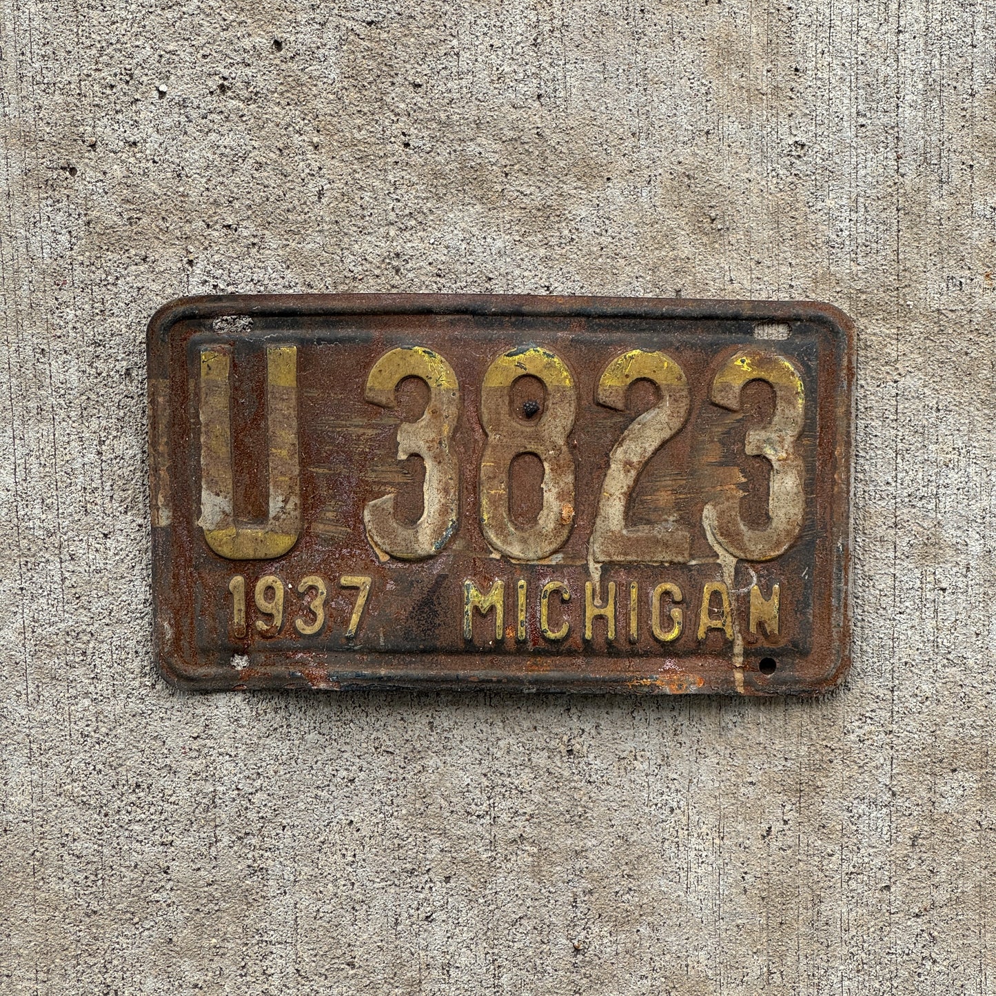 Photo of a 1937 Michigan License Plate Auto Tag Garage Decor Vintage U 3823 with original patina