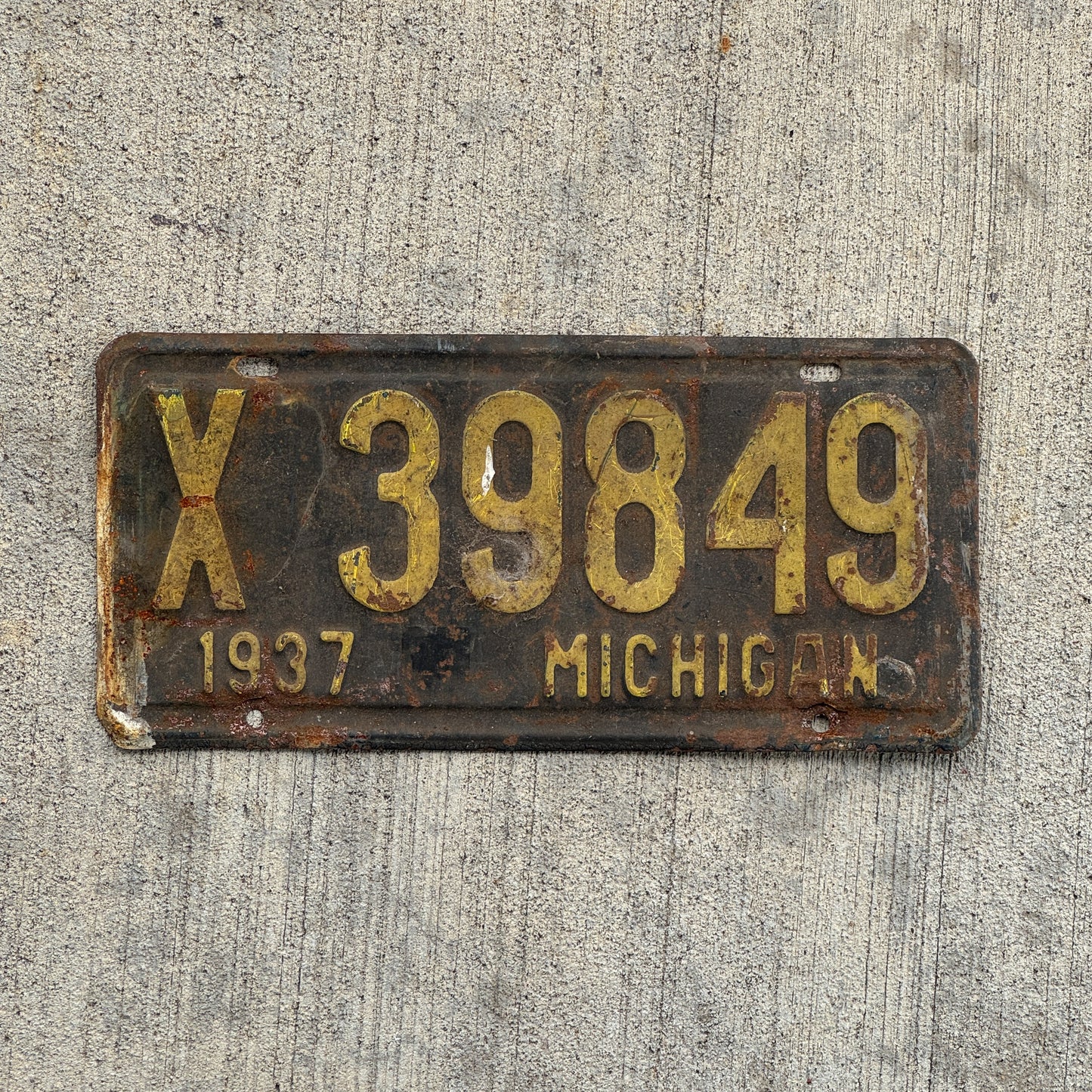 Photo of a 1937 Michigan License Plate Auto Tag Garage Decor Vintage X 39849 with original patina