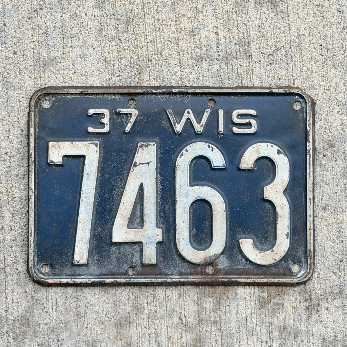 Photo of a 1937 Wisconsin License Plate Auto Tag Garage Decor Vintage Low Number Four Digit 7463 with original patina