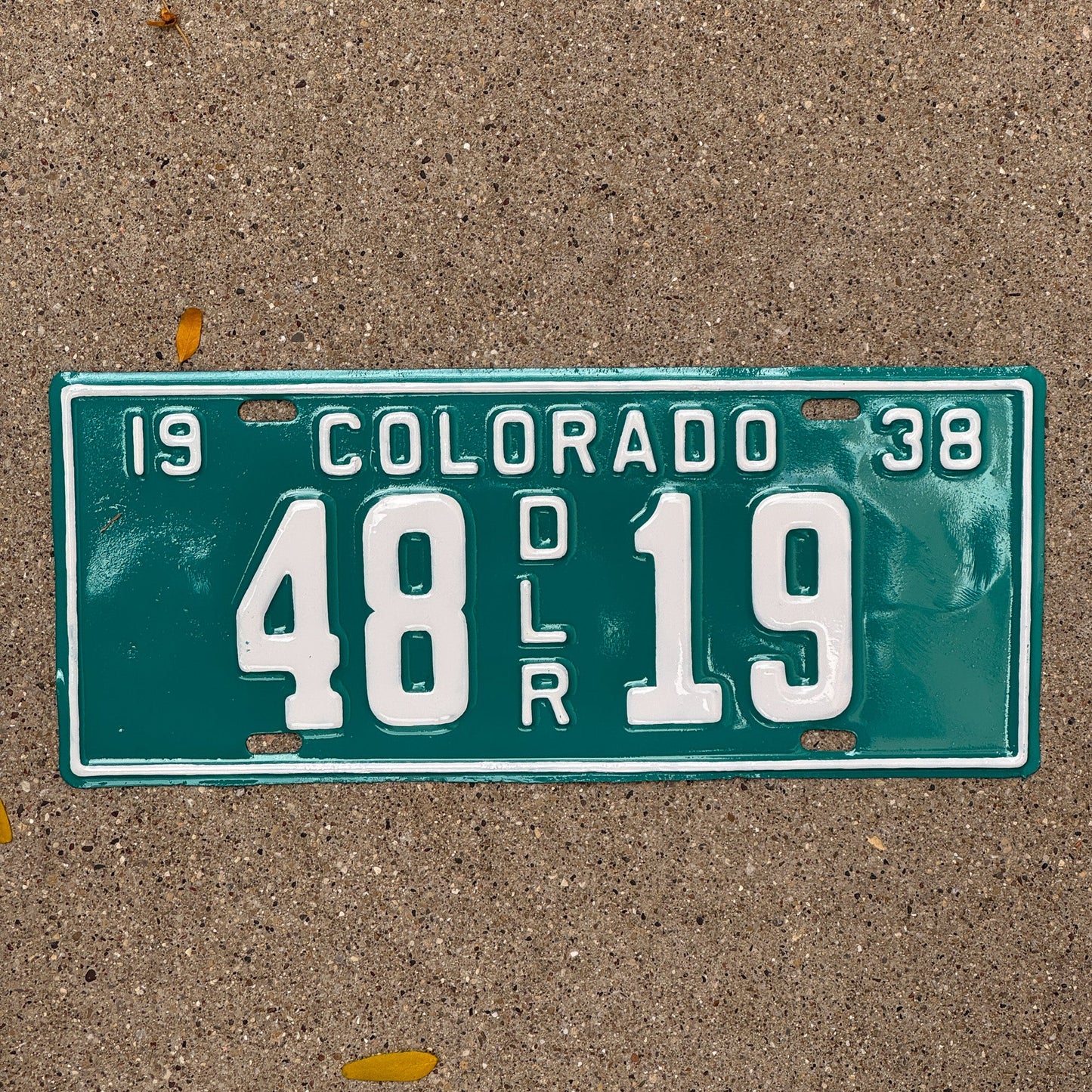 Photo of a 1938 Colorado Dealer License Plate Auto Tag Garage Decor Vintage 48 19 with original patina