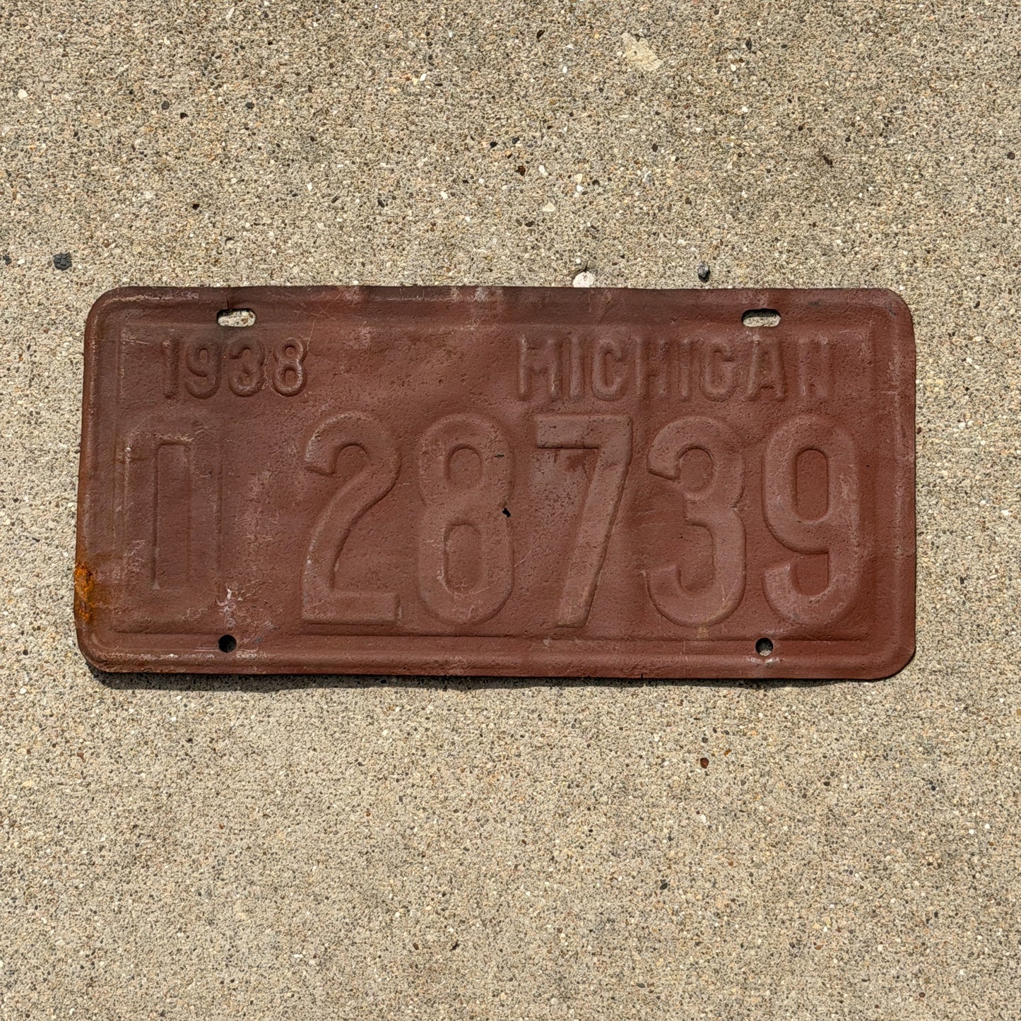Photo of a 1938 Michigan License Plate Auto Tag Garage Decor Vintage 0 28739 with original patina