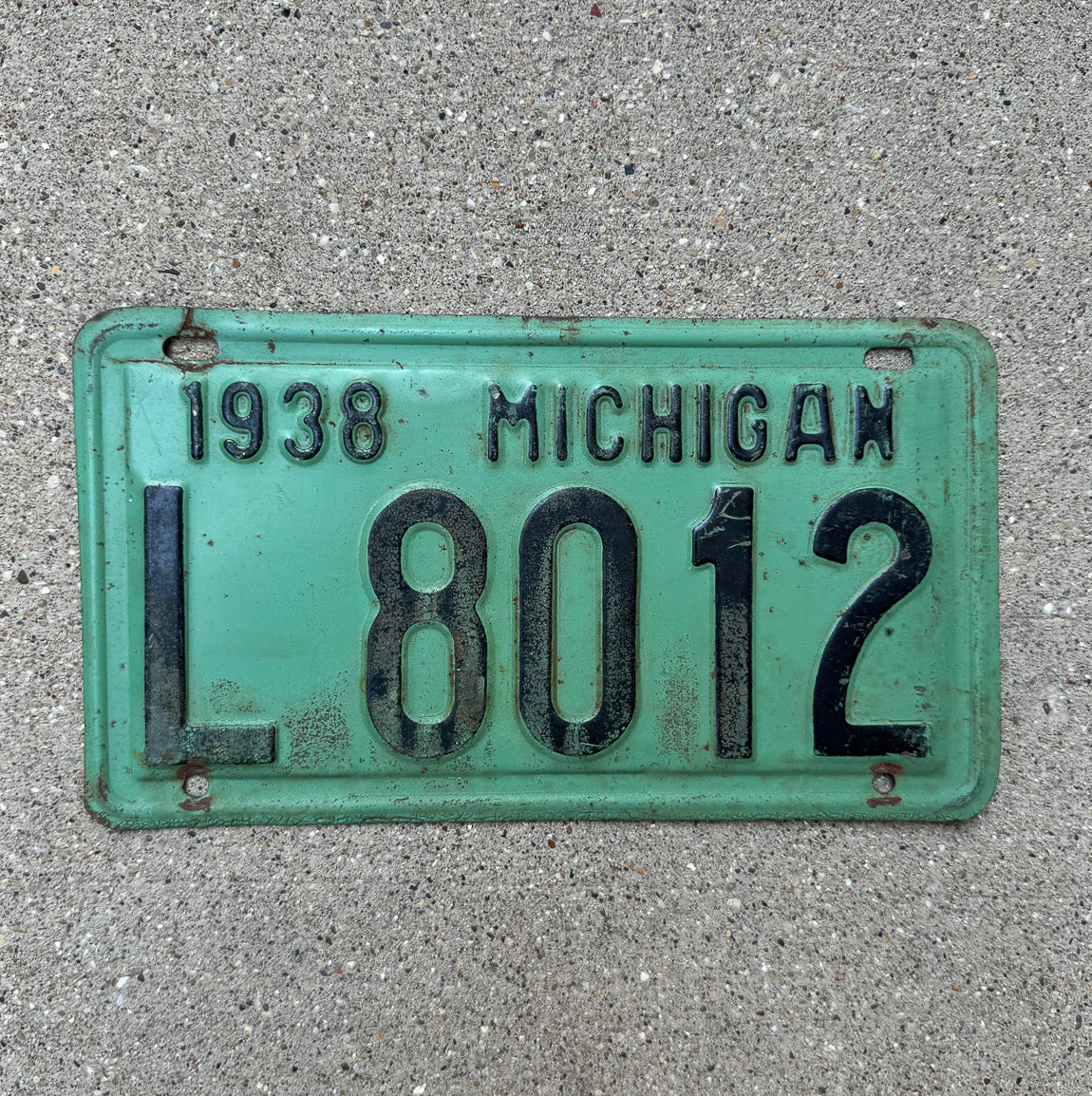 Photo of a 1938 Michigan License Plate Auto Tag Garage Decor Vintage L 8012 with original patina
