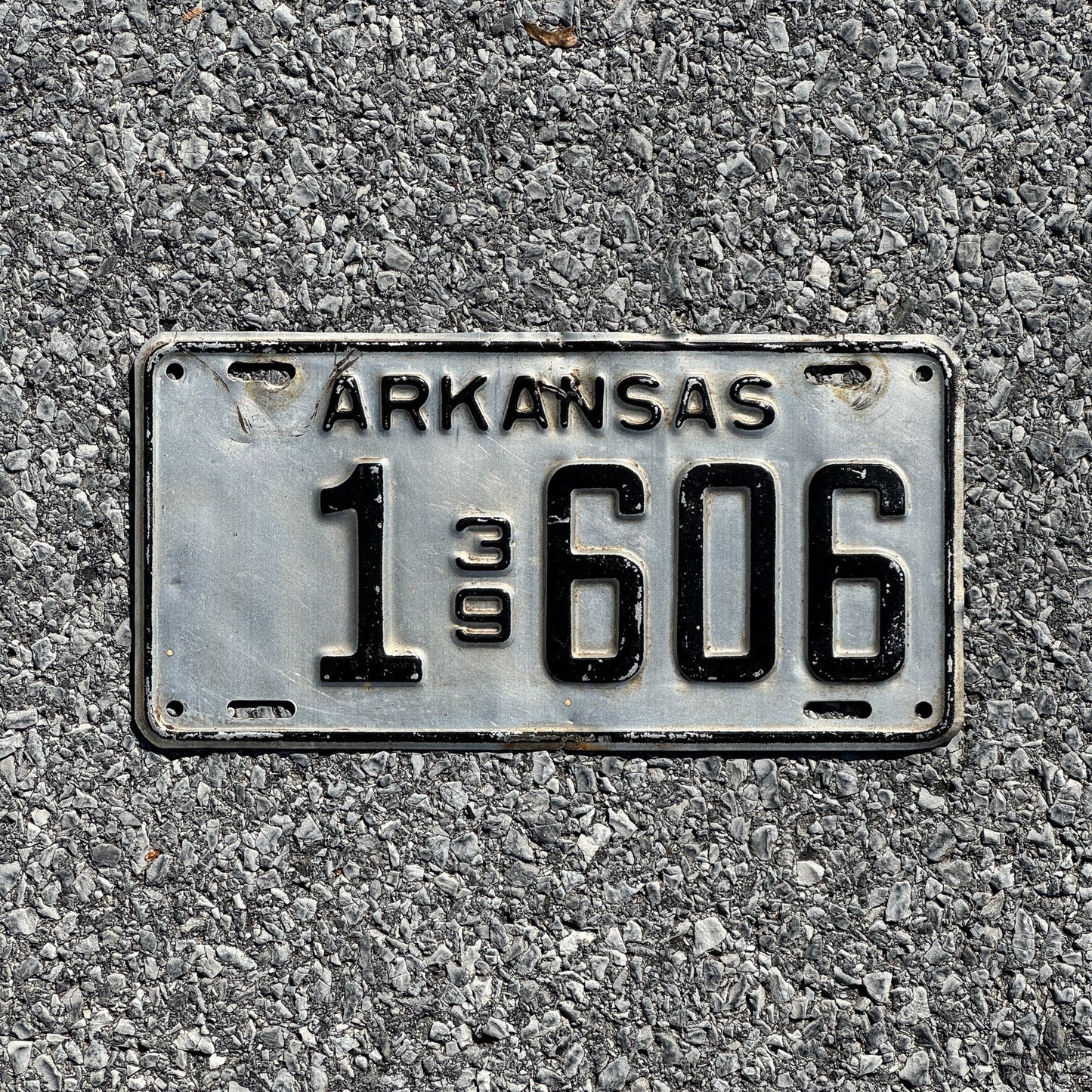Photo of a 1939 Arkansas License Plate Auto Tag Garage Decor Vintage Four Digit Low Number 1606