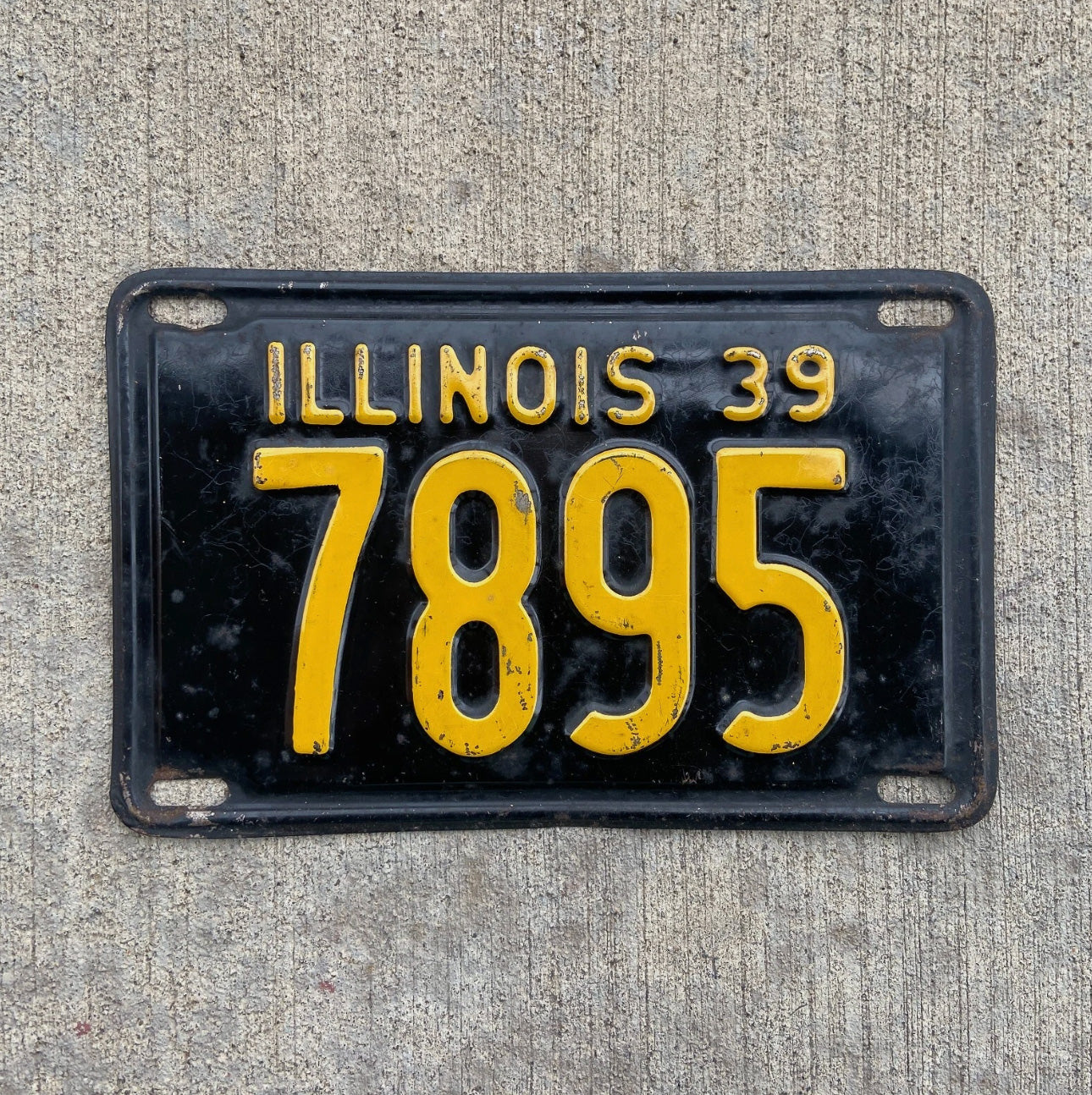 Photo of a 1939 Illinois License Plate Auto Tag Garage Decor Vintage Low Number Four Digit 7895 with original patina
