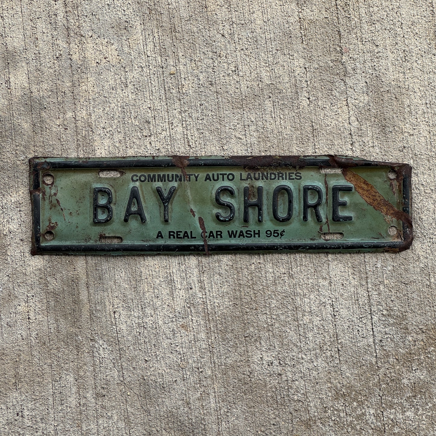 Photo of a 1940 Era Bay Shore Long Island New York License Plate Topper Auto Tag Garage Decor Vintage Community Auto Laundries Car Wash with original patina