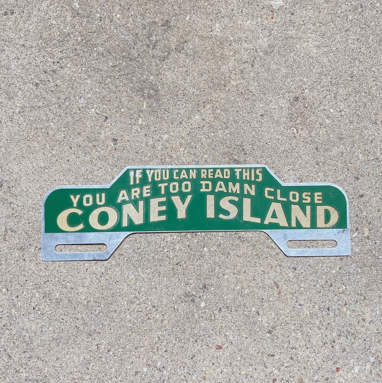 Photo of a 1940 Era Coney Island New York License Plate Topper Auto Tag Garage Decor Vintage Too Damn Close Smaltz Paint with original patina