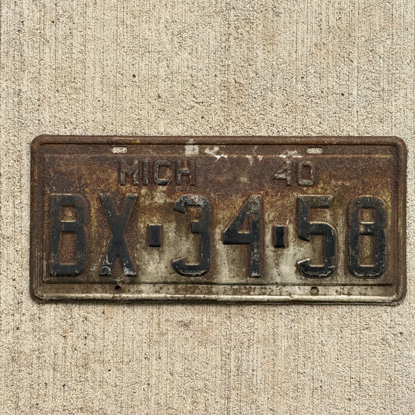 Photo of a 1940 Michigan License Plate Auto Tag Garage Decor Vintage BX 34 58 with original patina
