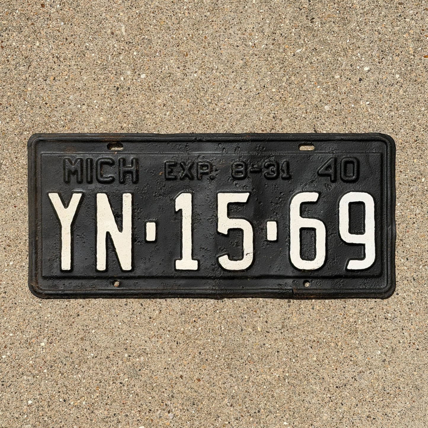 Photo of a 1940 Michigan License Plate Auto Tag Garage Decor Vintage Half Year YN 15 69 with original patina