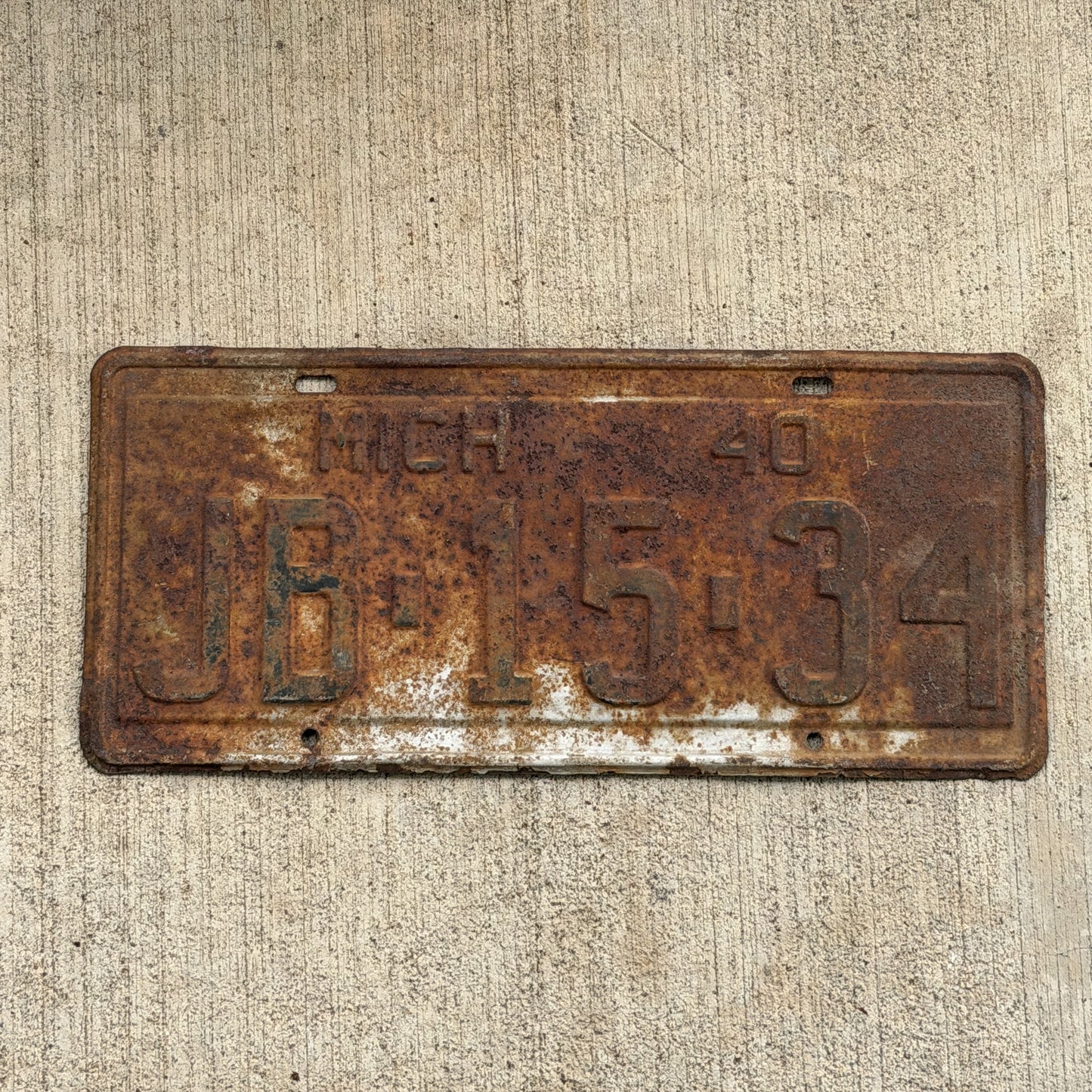 Photo of a 1940 Michigan License Plate Auto Tag Garage Decor Vintage JB 15 34 with original patina