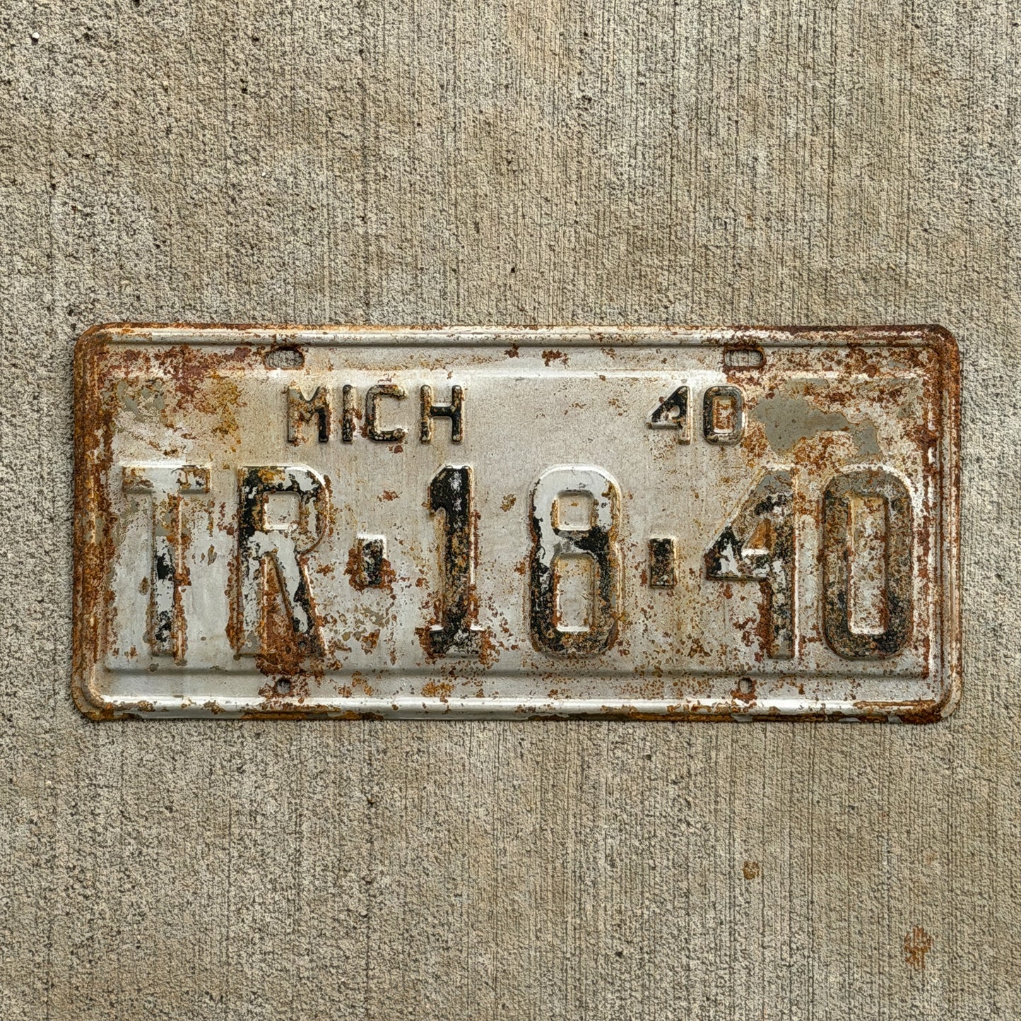 Photo of a 1940 Michigan License Plate Auto Tag Garage Decor Vintage TR 18 40 with original patina