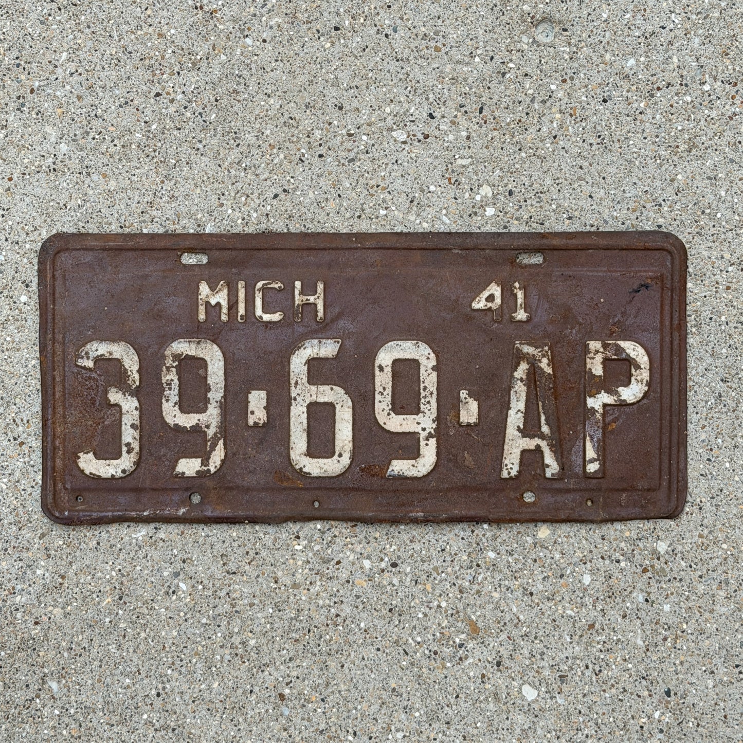 Photo of a 1941 Michigan Commercial License Plate Auto Tag Garage Decor Vintage 39 69 AP with original patina