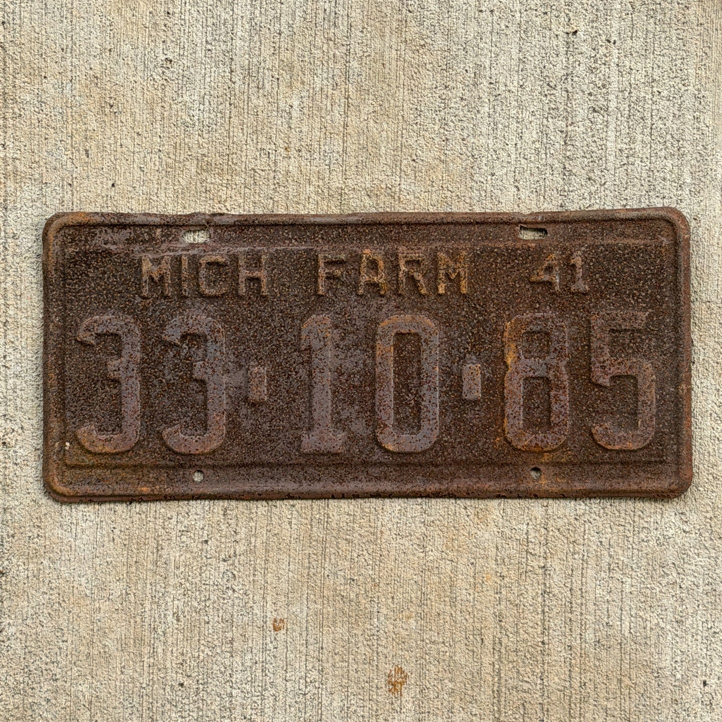 Photo of a 1941 Michigan Farm License Plate Auto Tag Garage Decor Vintage 33 10 85 with original patina