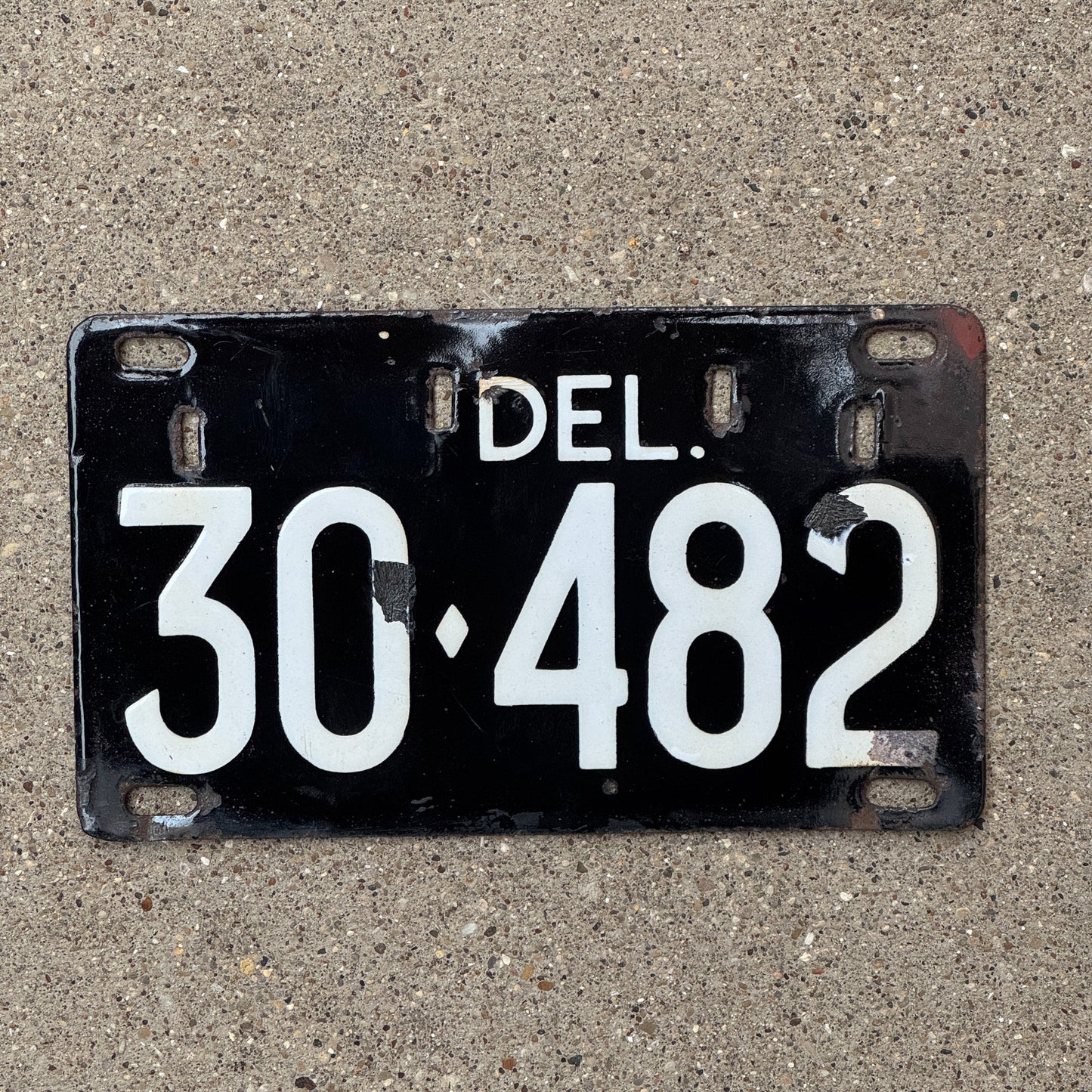 Photo of a 1942 Delaware Porcelain License Plate Auto Tag Garage Decor Vintage 30 482 with original patina