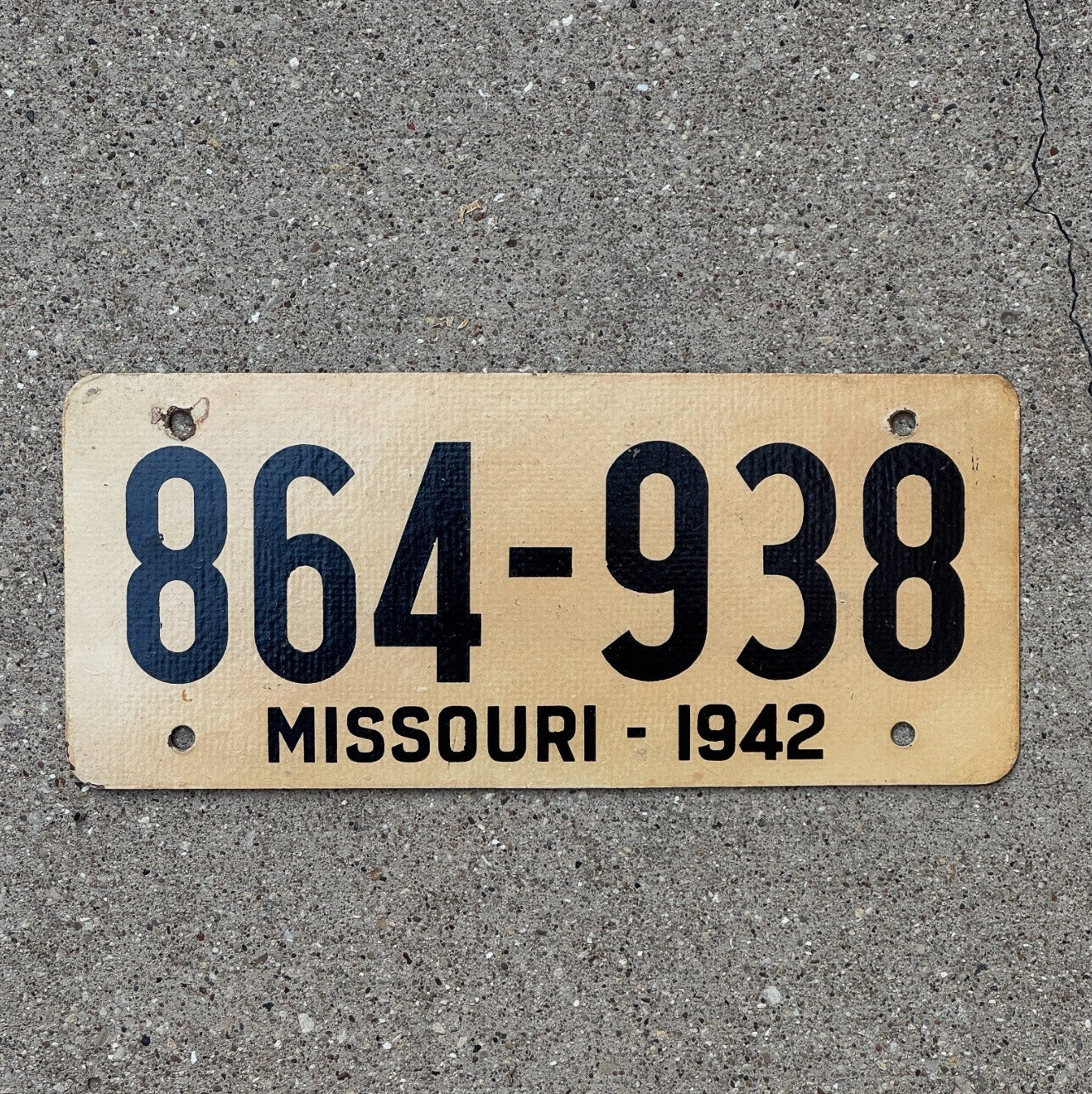 Photo of a 1942 Missouri Fiberboard License Plate Auto Tag Garage Decor Vintage High Quality WWII War Year 864 938 with original patina