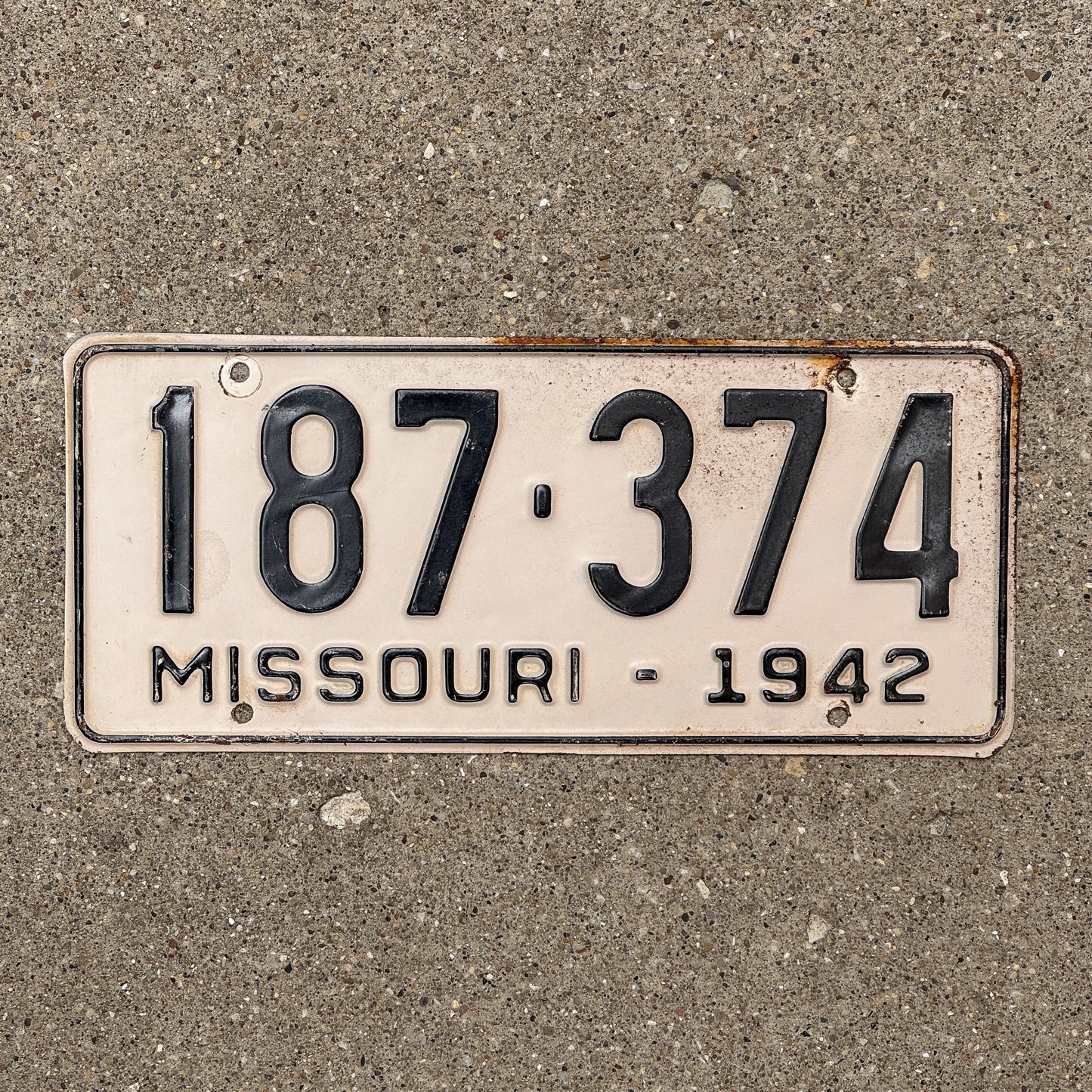 Photo of a 1942 Missouri License Plate Auto Tag Garage Decor Vintage 187 374 with original patina