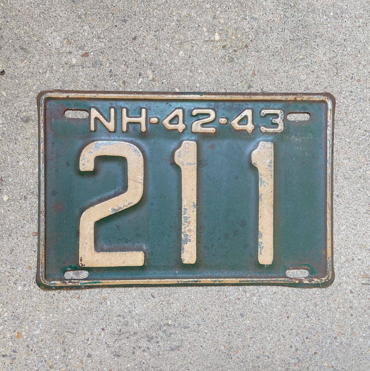 Photo of a 1942 New Hampshire License Plate Auto Tag Garage Decor Vintage Low Number Three Digit 211 with original patina