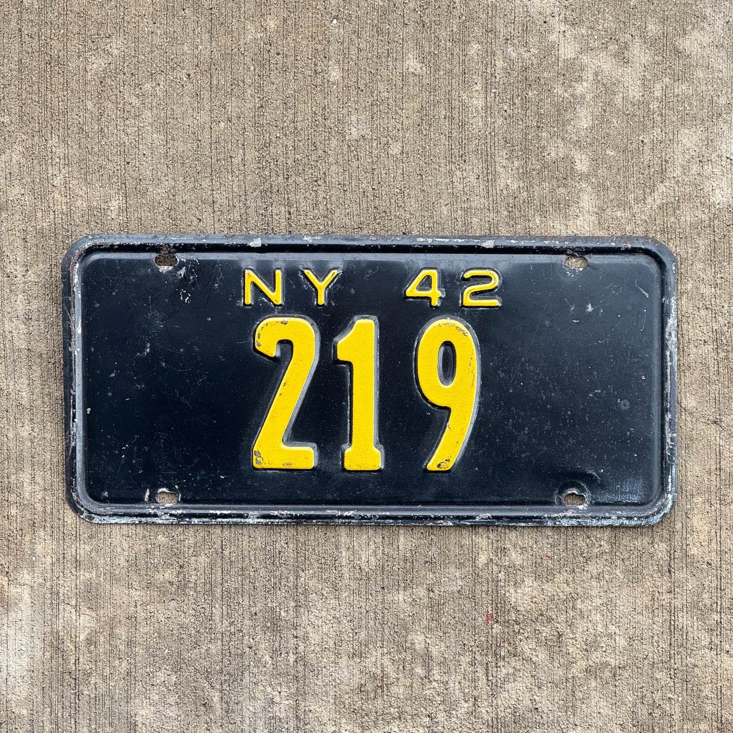Photo of a 1942 New York Reserved License Plate Auto Tag Garage Decor Vintage Low Number Three Digit 219 with original patina