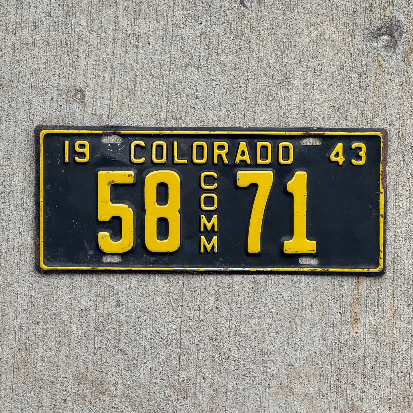 Photo of a 1943 Colorado Commercial License Plate Auto Tag Garage Decor Vintage 58 71 with original patina