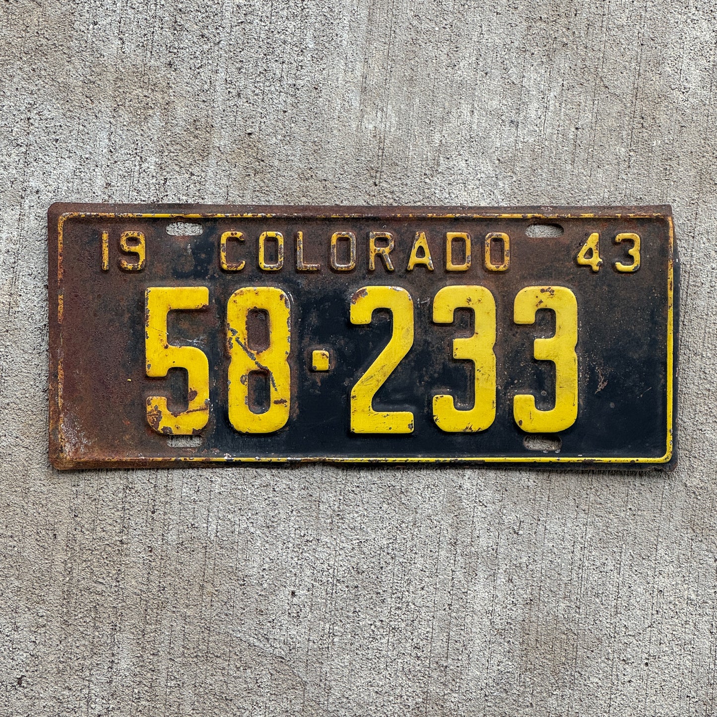 Photo of a 1943 Colorado License Plate Auto Tag Garage Decor Vintage 58 233 with original patina