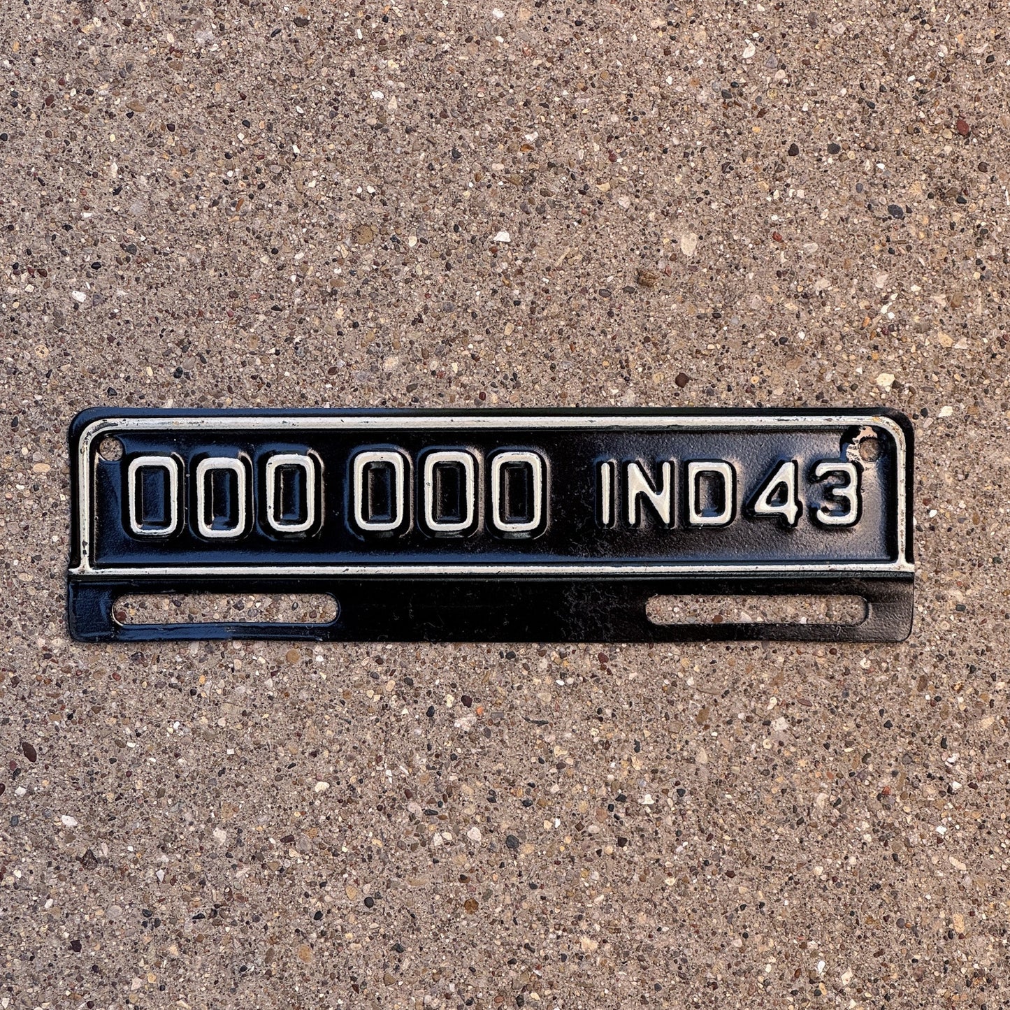 Photo of a 1943 Indiana Sample Tab License Plate Auto Tag Garage Decor Vintage 000 000 with original patina